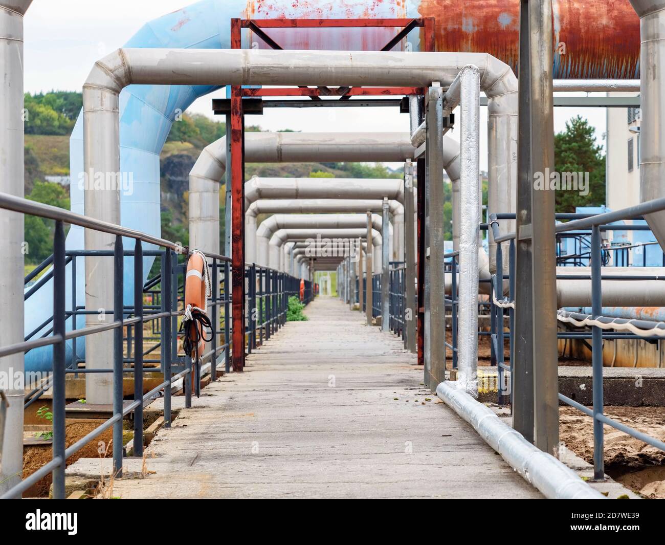 Steel water pipes and air tubes at waste water tanks. Town industrial