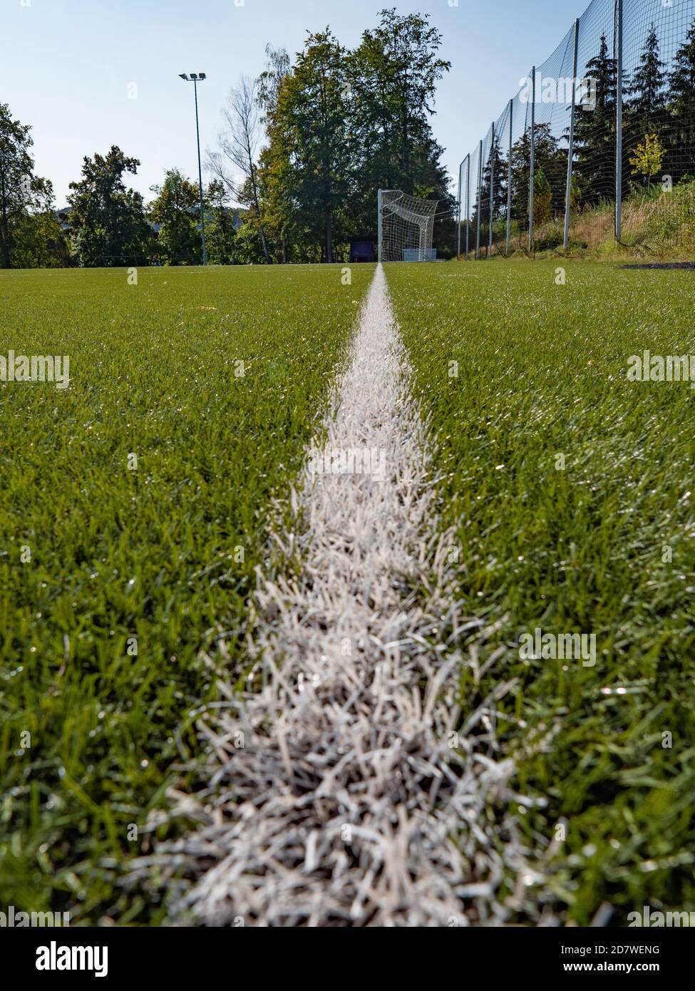 Lines on soccer football field, sport background. Green Artificial Grass Turf Field with White