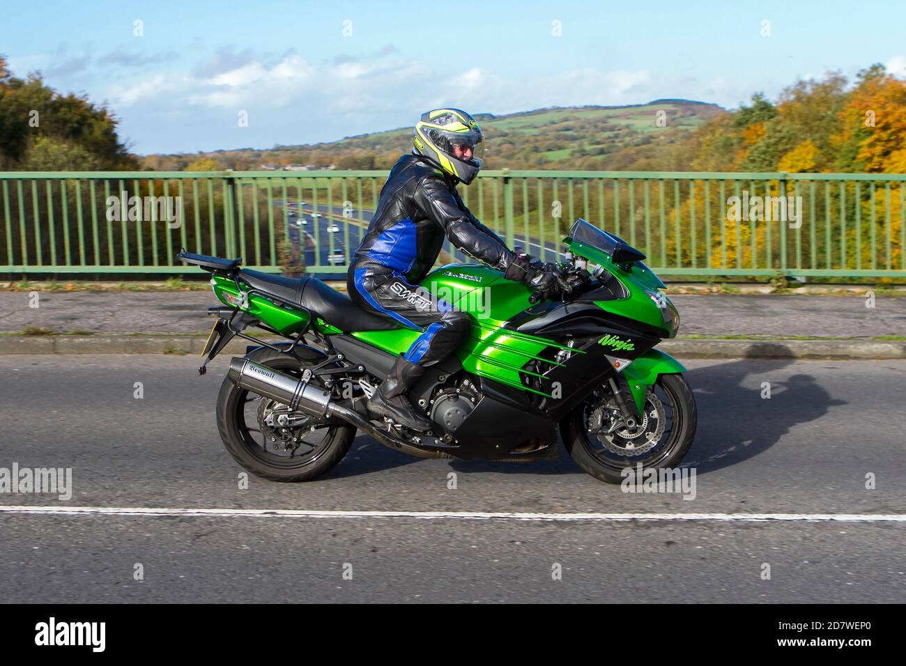 A male motorcyclist riding a Kawasaki Ninja motorbike over the M6 bridge at  Rivington near Chorley in Lancashire, UK Stock Photo - Alamy