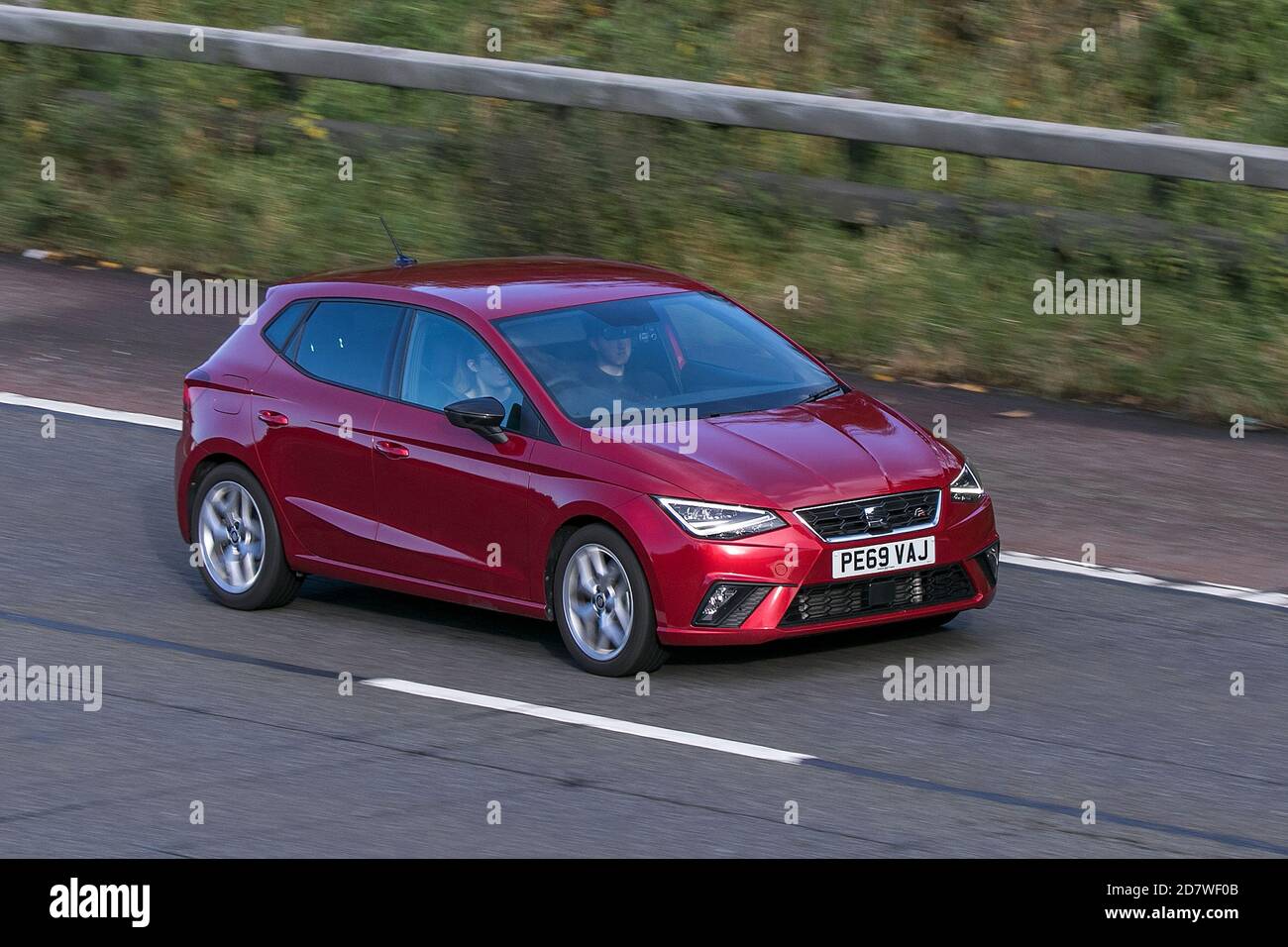 2019 red SEAT Ibiza FR TSI; moving ehicle driving on the M61 motorway near Manchester, UK Stock Photo