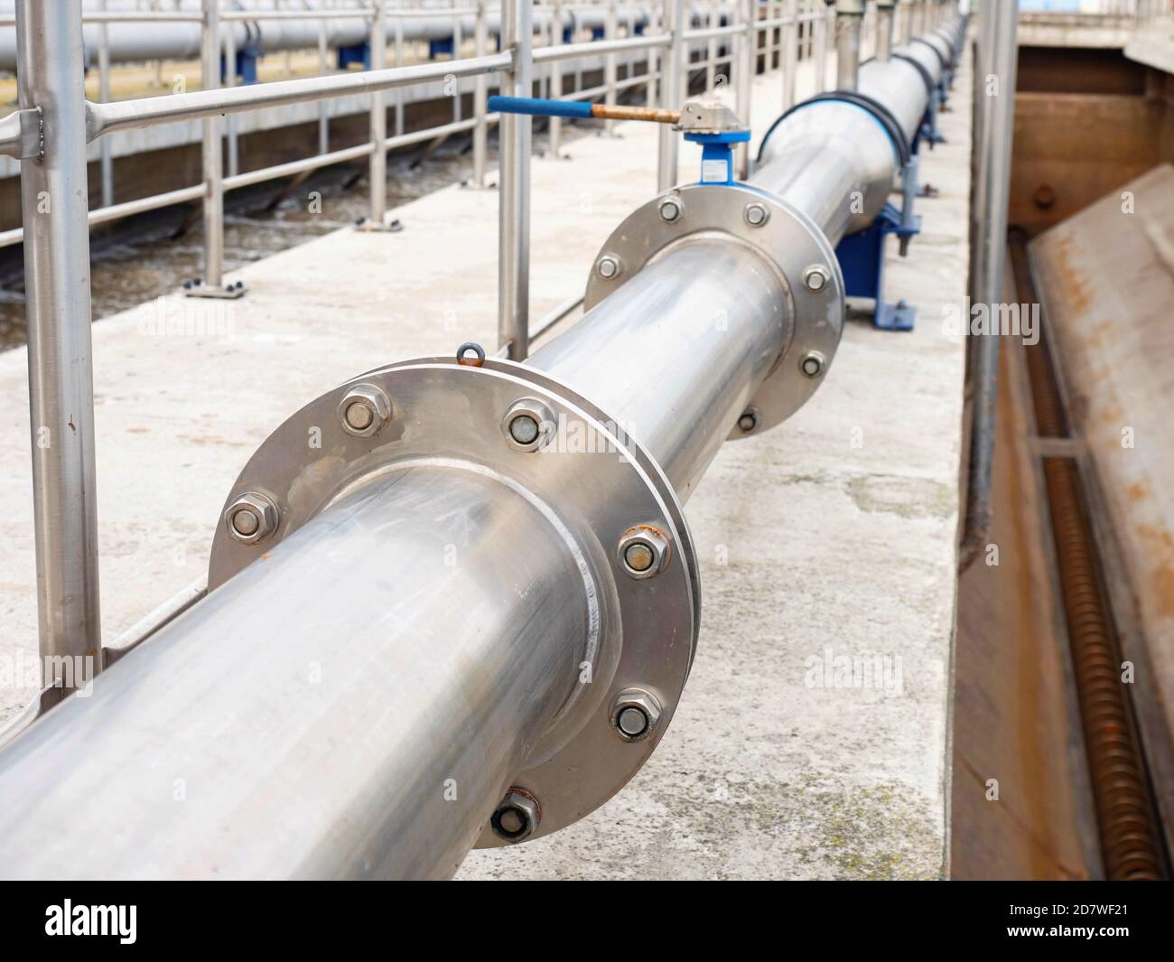 Stainless piping for high press air, wastewater tank in modern industrial wastewater  treatment plan in city Stock Photo