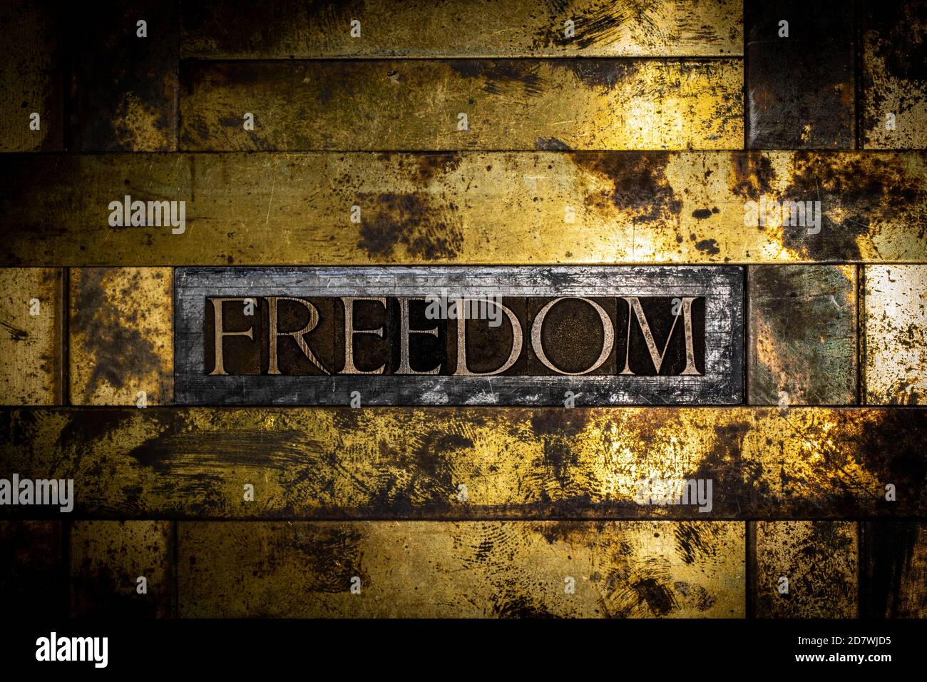 Freedom text message on vintage textured grunge copper and gold background Stock Photo