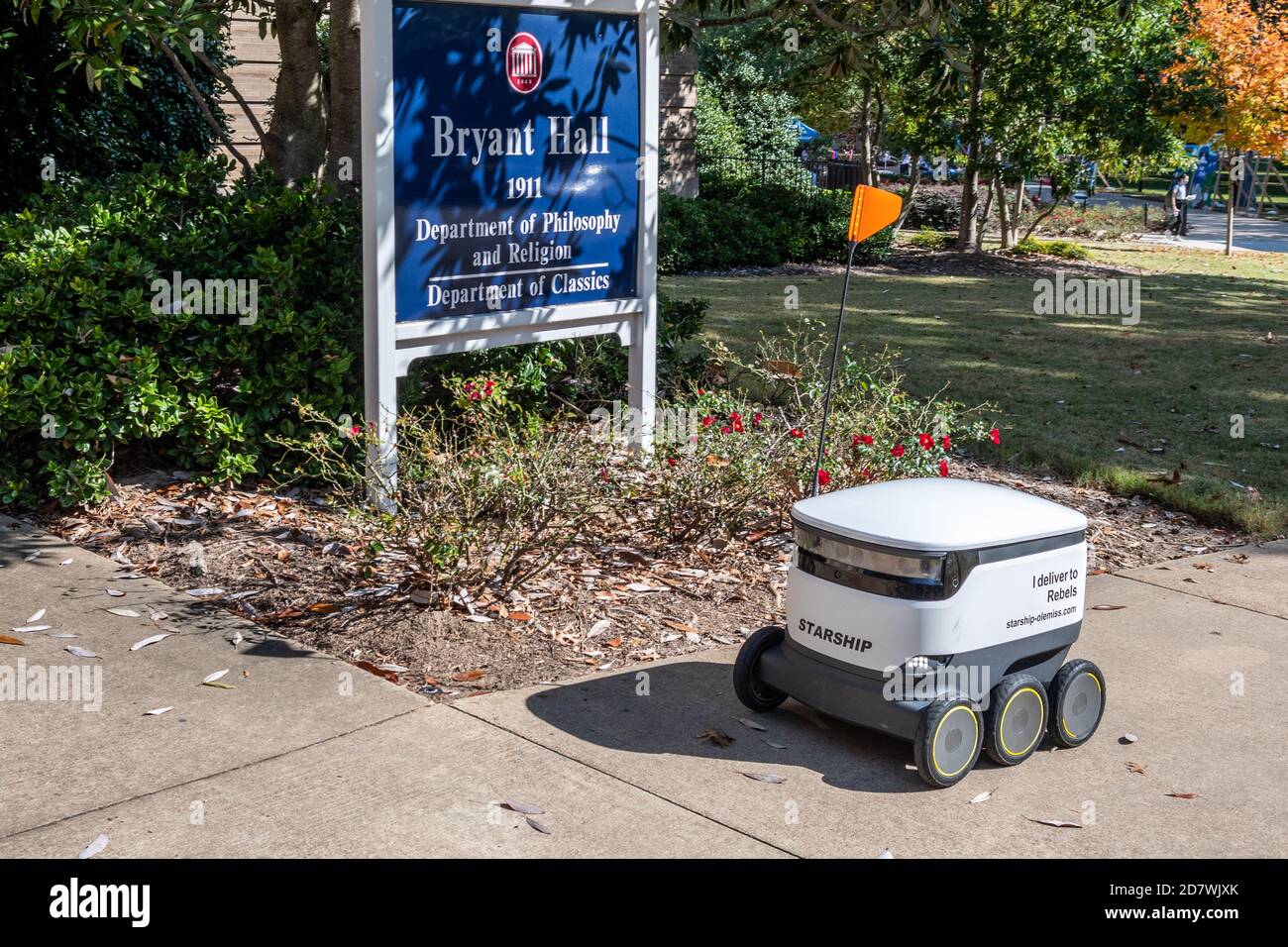 Starship Delivery Robot roams the campus of the University of Mississippi delivering food with Starship Technologies autonomous delivery service. Stock Photo
