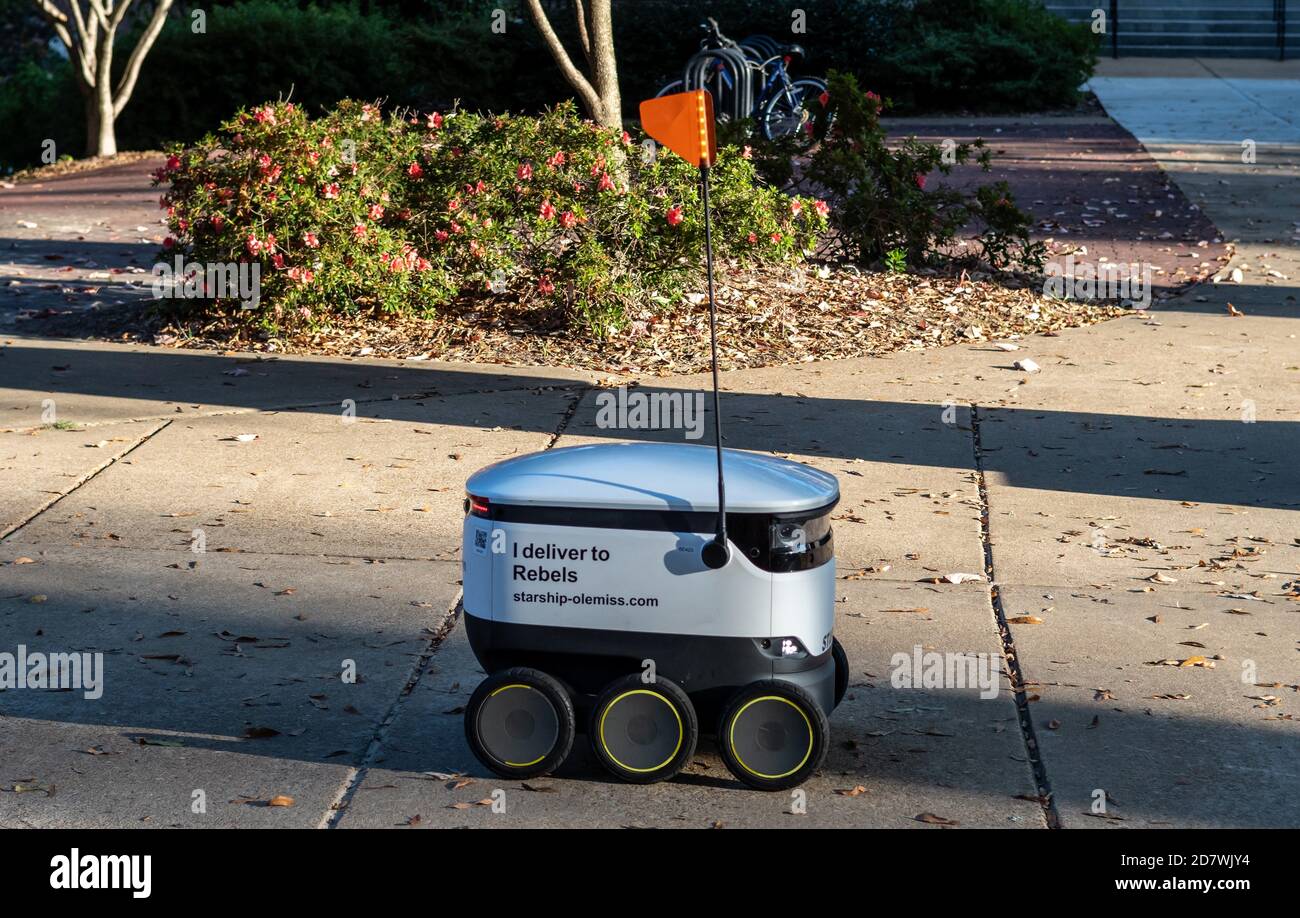 Starship Robot Delivery on  the campus of the University of Mississippi delivering food with Starship Technologies autonomous delivery service. Stock Photo