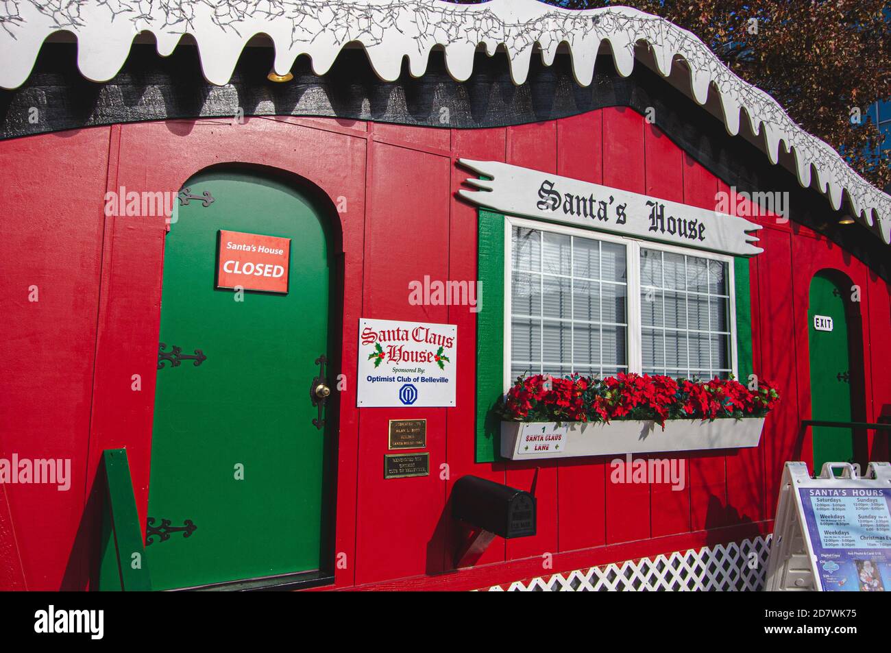 Belleville, IL--Nov 23, 2018; red and green wooden North Pole Santa House on display by local optimist club for kids to visit Santa Clause during holi Stock Photo