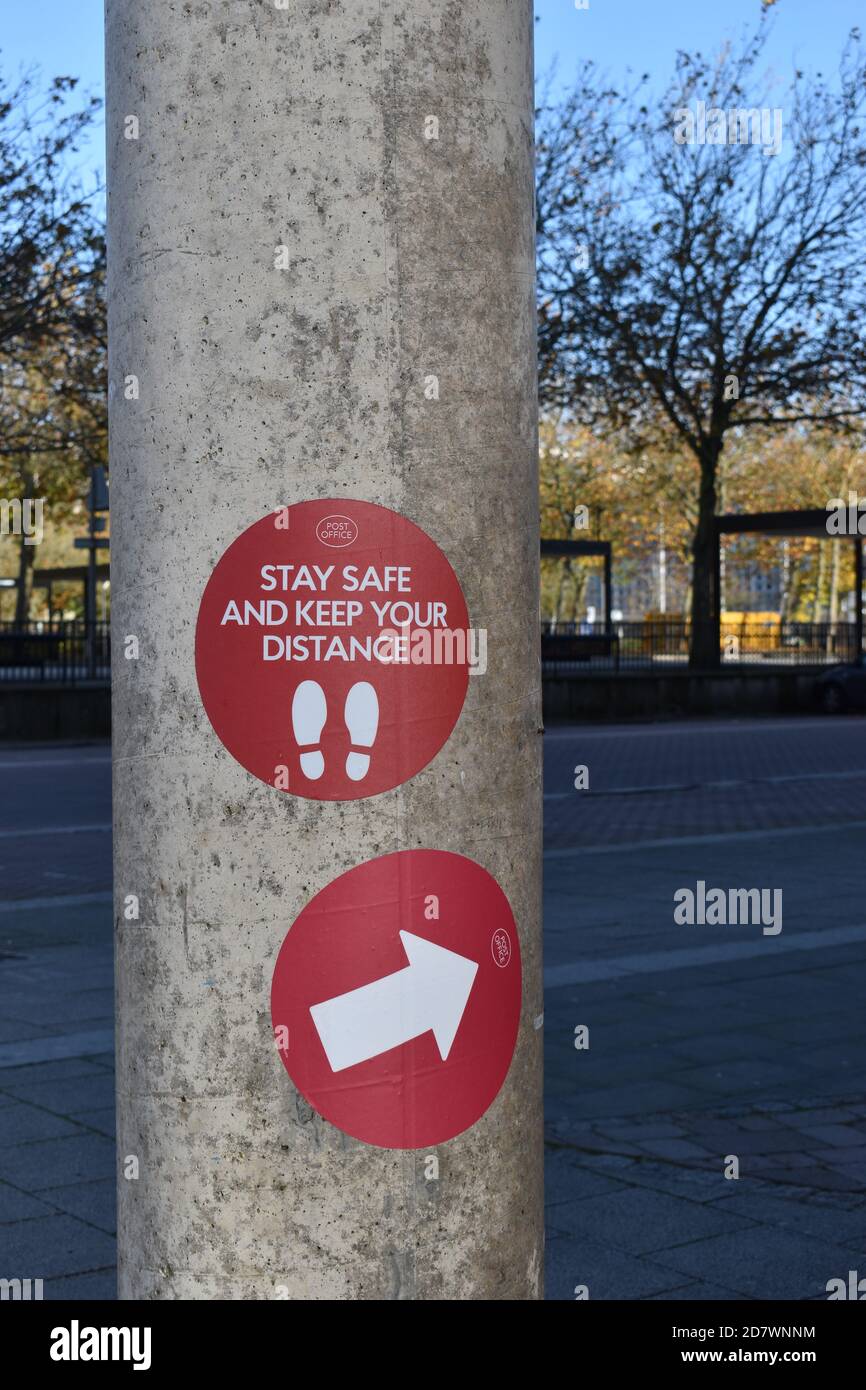 Stay safe and keep your distance signage at Central Milton Keynes Post Office. Stock Photo