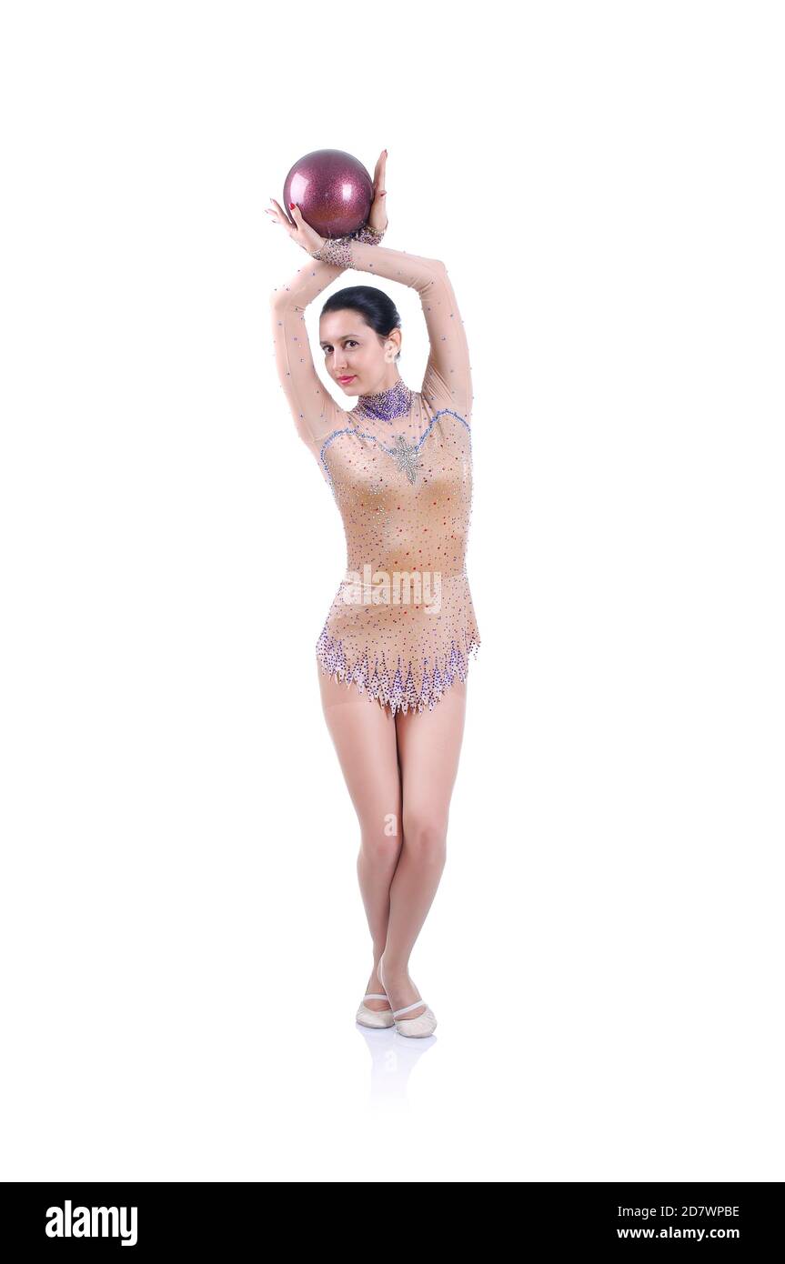 Beautiful artistic female gymnast working out, performing art gymnastics element Stock Photo