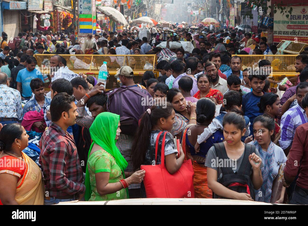 Shoppers crowd the streets in a market in the Sadar Bazar district of