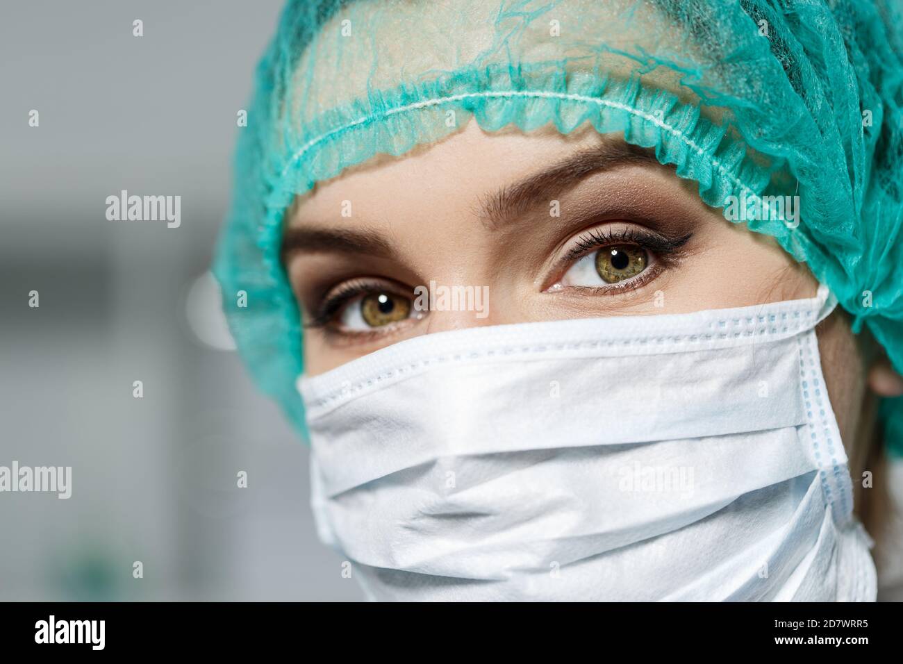 Female doctor's face wearing protective mask Stock Photo