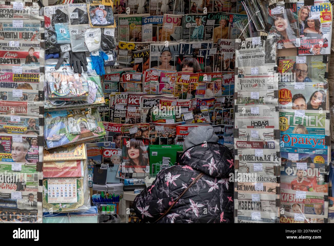 Moscow, Russia. 25th of October, 2020 A woman sells Russian newspapers in a street newsstand on the central street of Moscow city, Russia Stock Photo