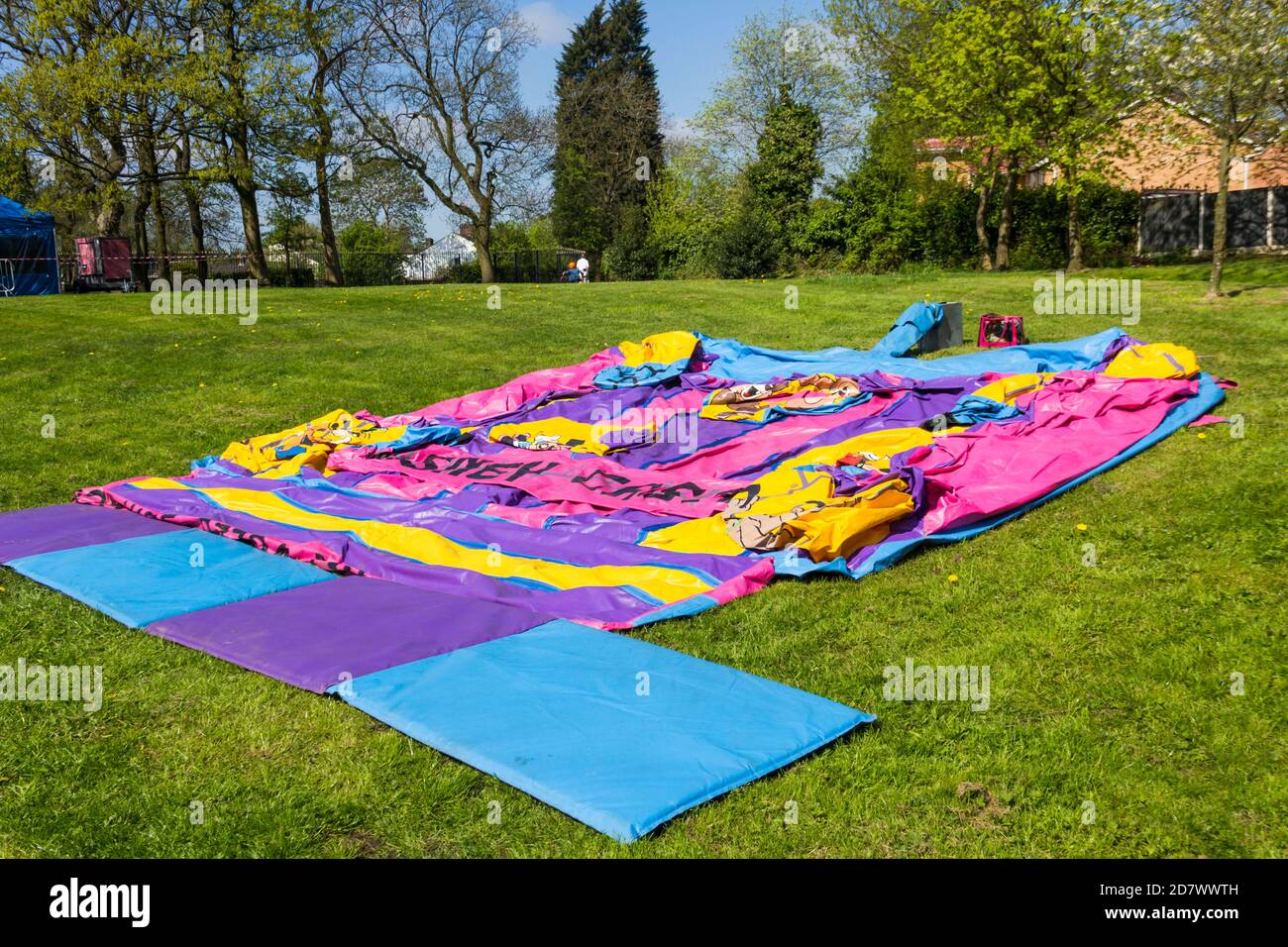 Bouncy castle laid out flat, ready to be inflated, Sited in Farnworth central park, Greater Manchester. for a family fun day event. Stock Photo