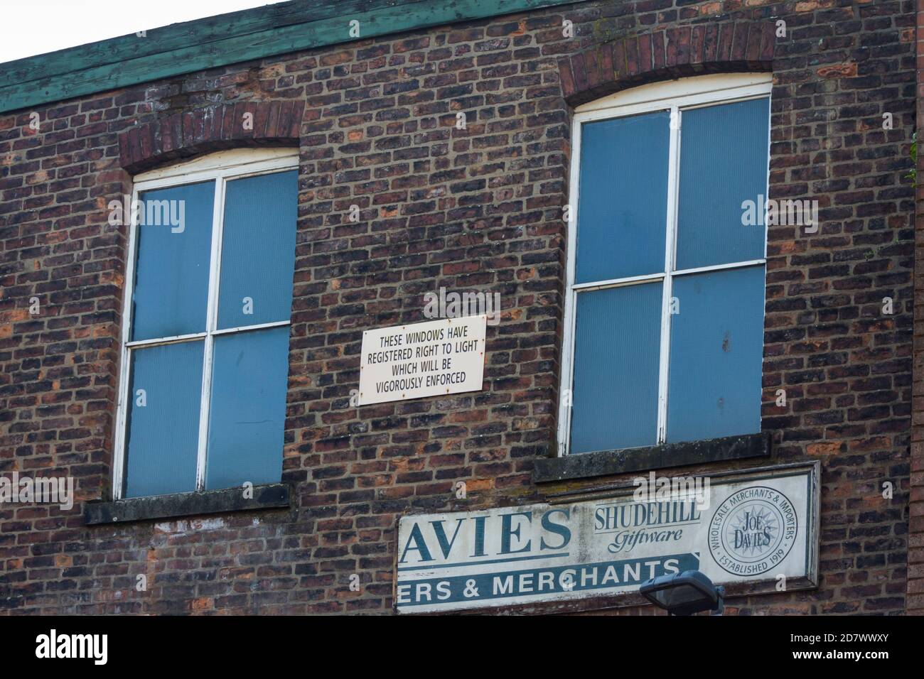 A sign proclaiming a registered windows Right to Lights sign on the grade II listed 19th century commercial building at 29 Shudehill, Manchester. Stock Photo