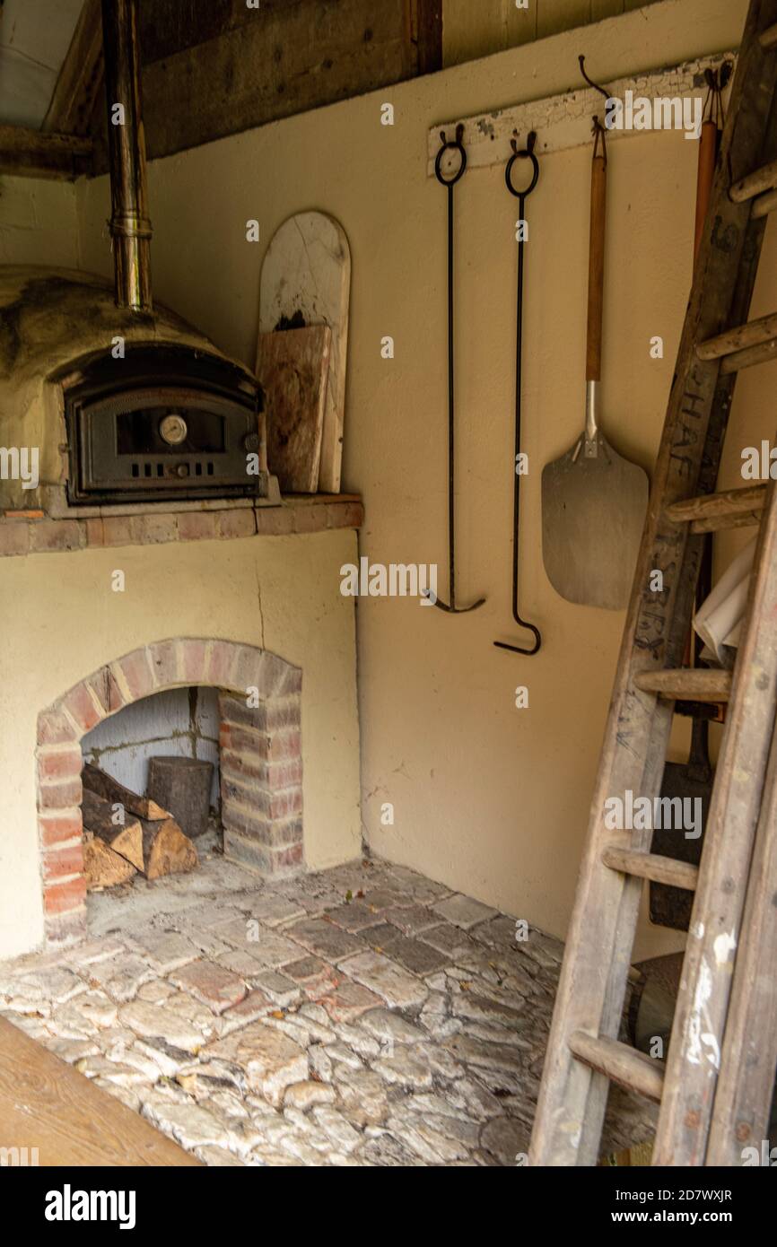 A pizza oven in a rustic barn Stock Photo