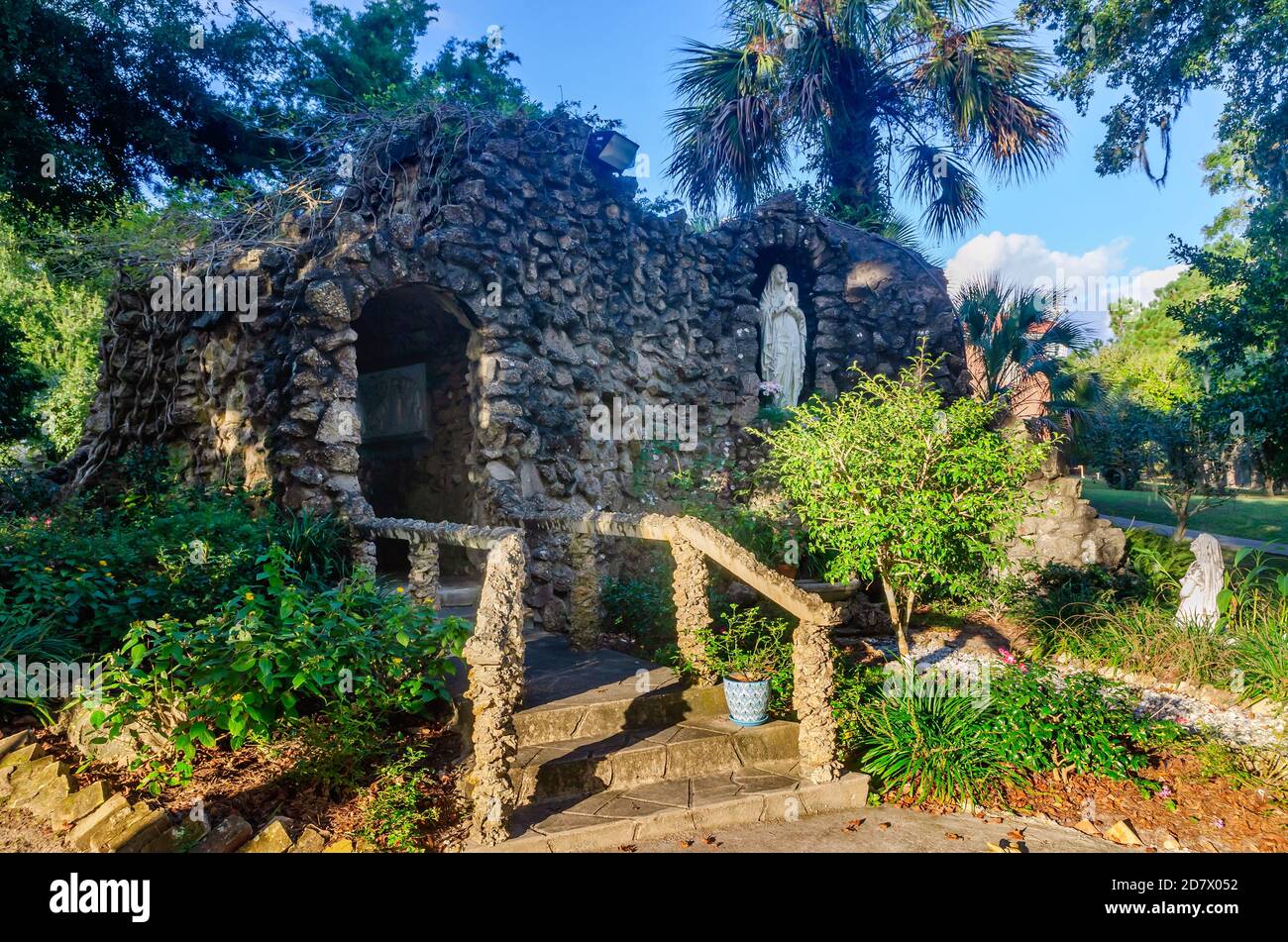 The sun sets on the Lourdes Grotto at St. Augustine’s Seminary, Oct. 24, 2020, in Bay Saint Louis, Mississippi.  The grotto was built in 1938. Stock Photo