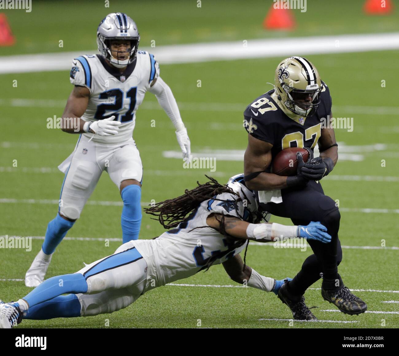 New Orleans, United States. 25th Oct, 2020. New Orleans Saints tight end Jared Cook (87) escapes from Carolina Panthers defenders Tre Boston (33) and Jeremy Chinn (21) at the Louisiana Superdome in New Orleans on Monday, October 25, 2020. Photo by AJ Sisco/UPI. Credit: UPI/Alamy Live News Stock Photo
