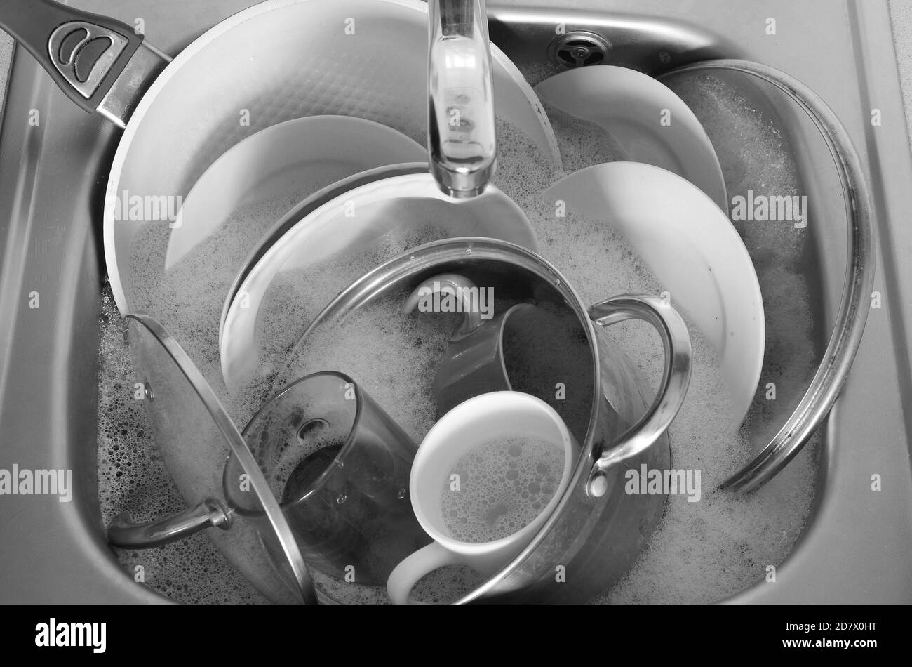 Dirty dishes and unwashed kitchen appliances filled the kitchen sink