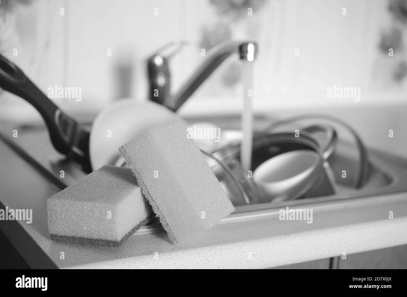 Cleaning dirty dishes Black and White Stock Photos & Images Alamy
