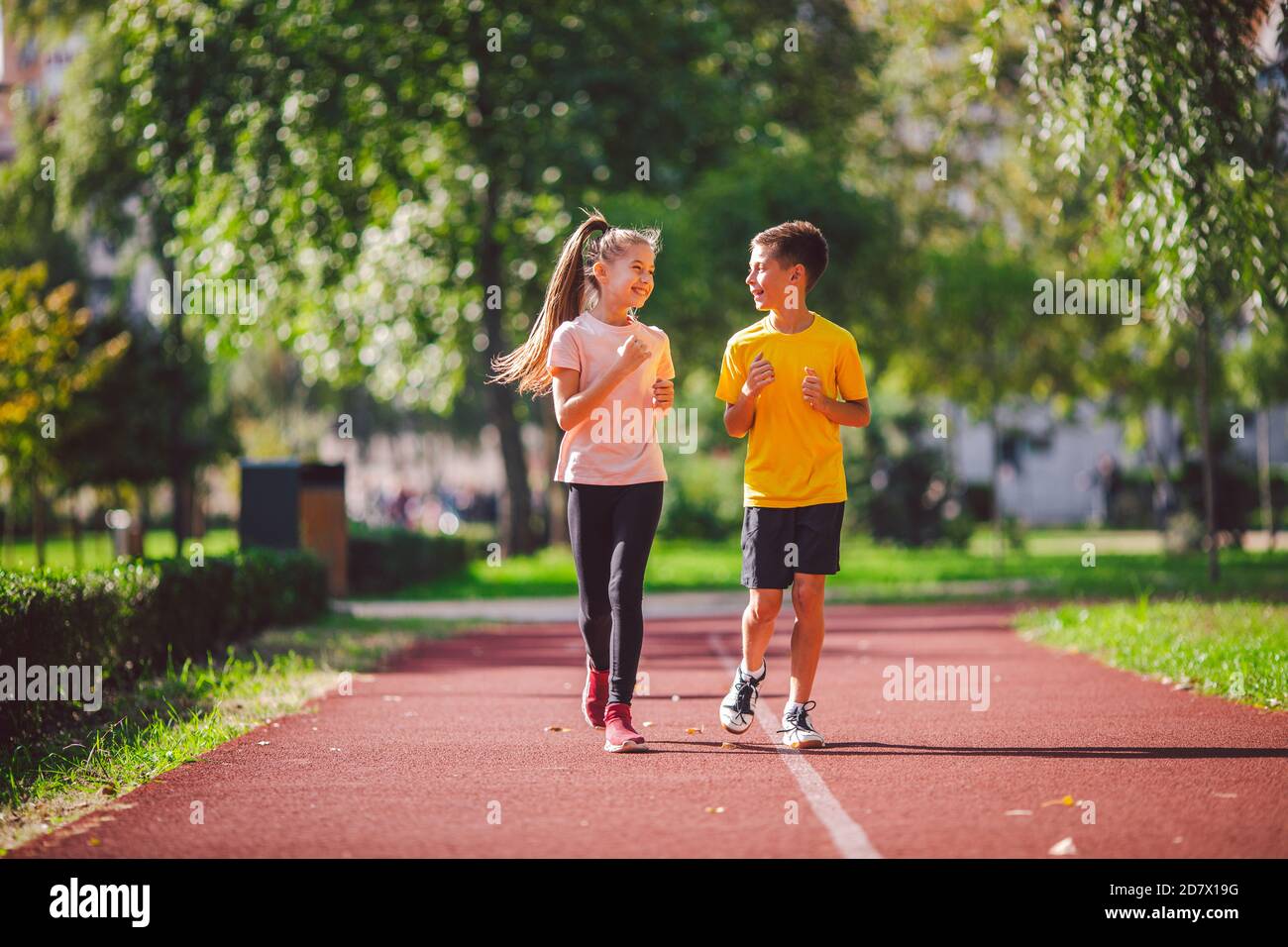 Kids run. Healthy sport. Child sport, heterosexual twins running on