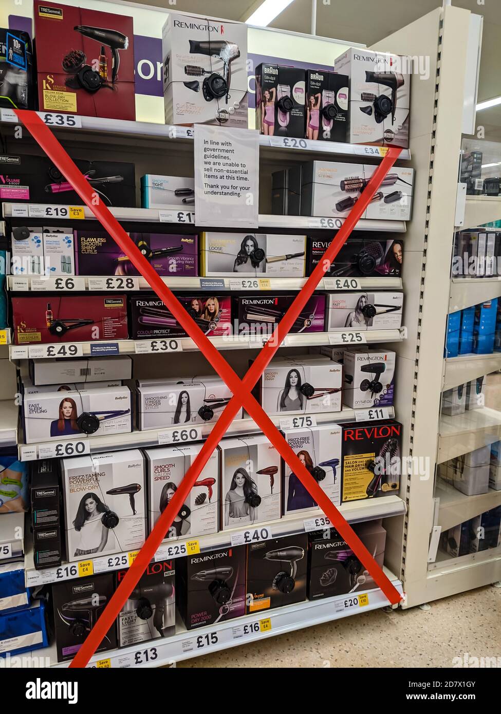 Tape closing off nonessential shopping items in a major supermarket in