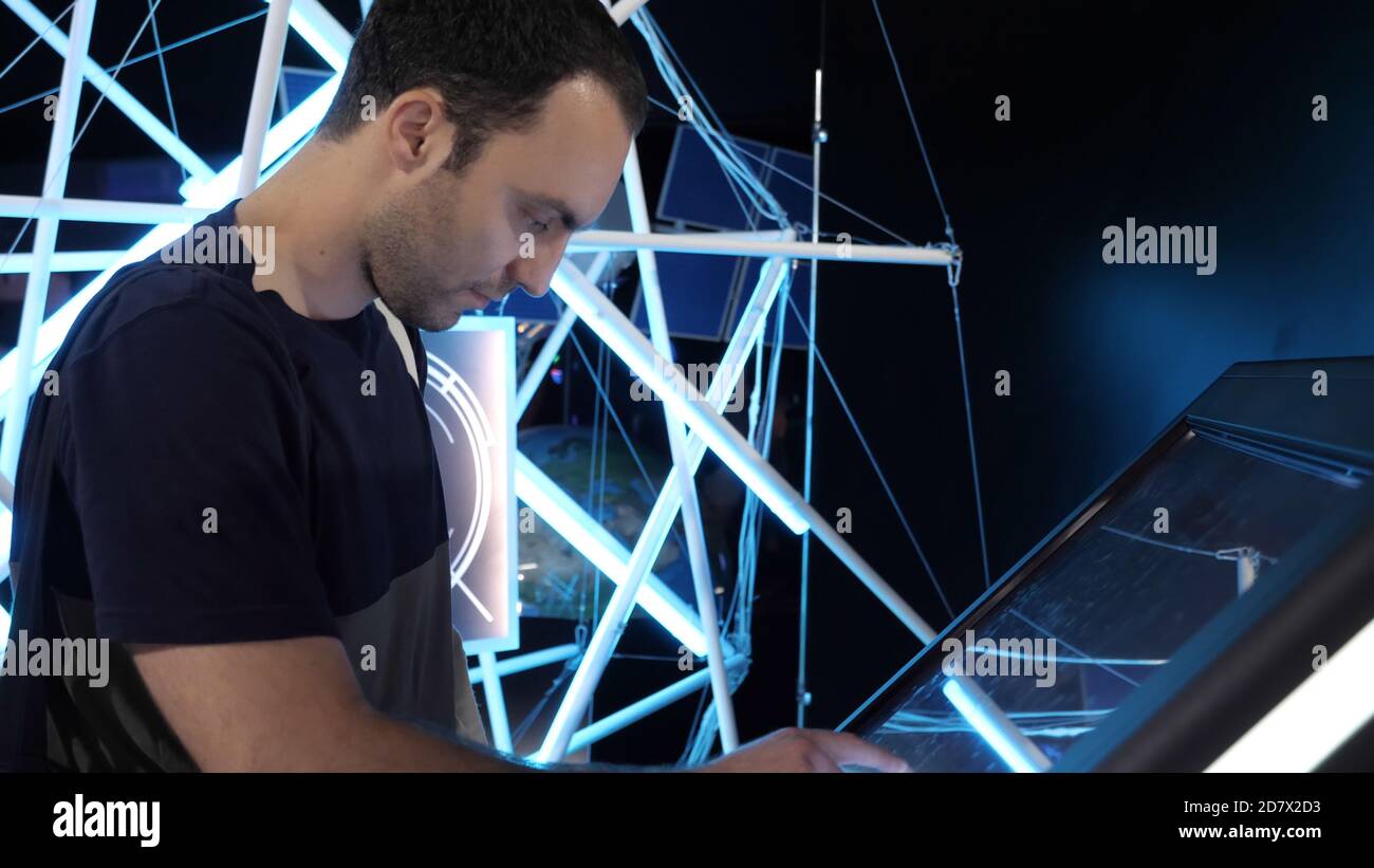 The man using huge touchscreen display. Stock Photo