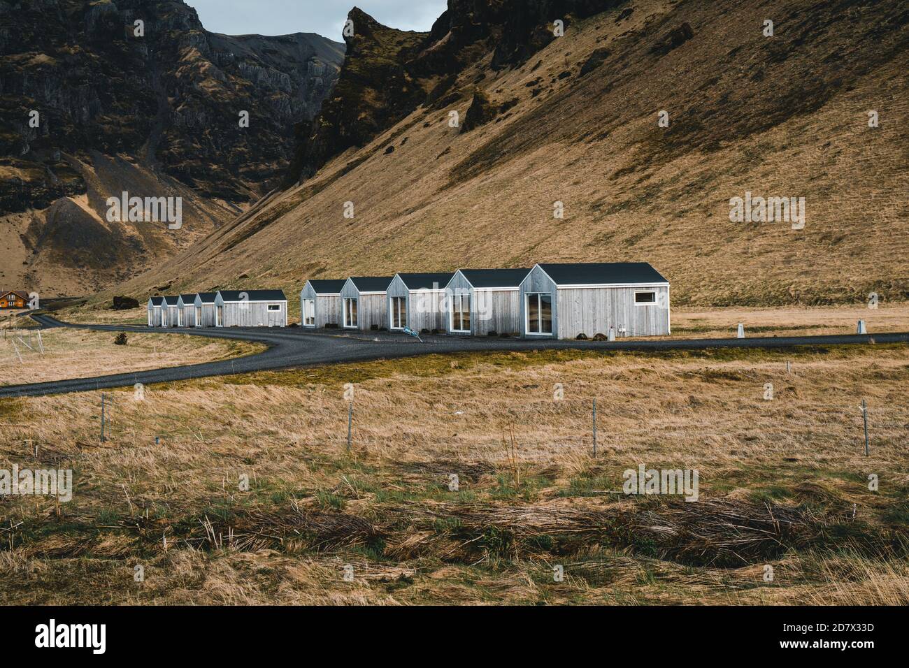 Iceland modern cottage house for tourist with beautiful mountain background Stock Photo