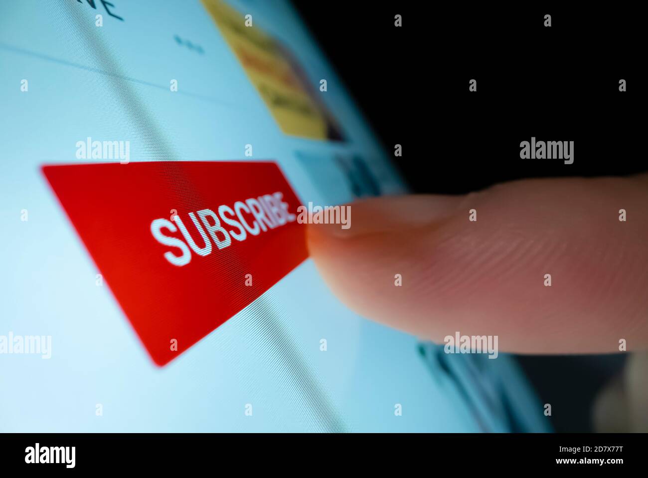 Clicking the subscribe button in YouTube Stock Photo