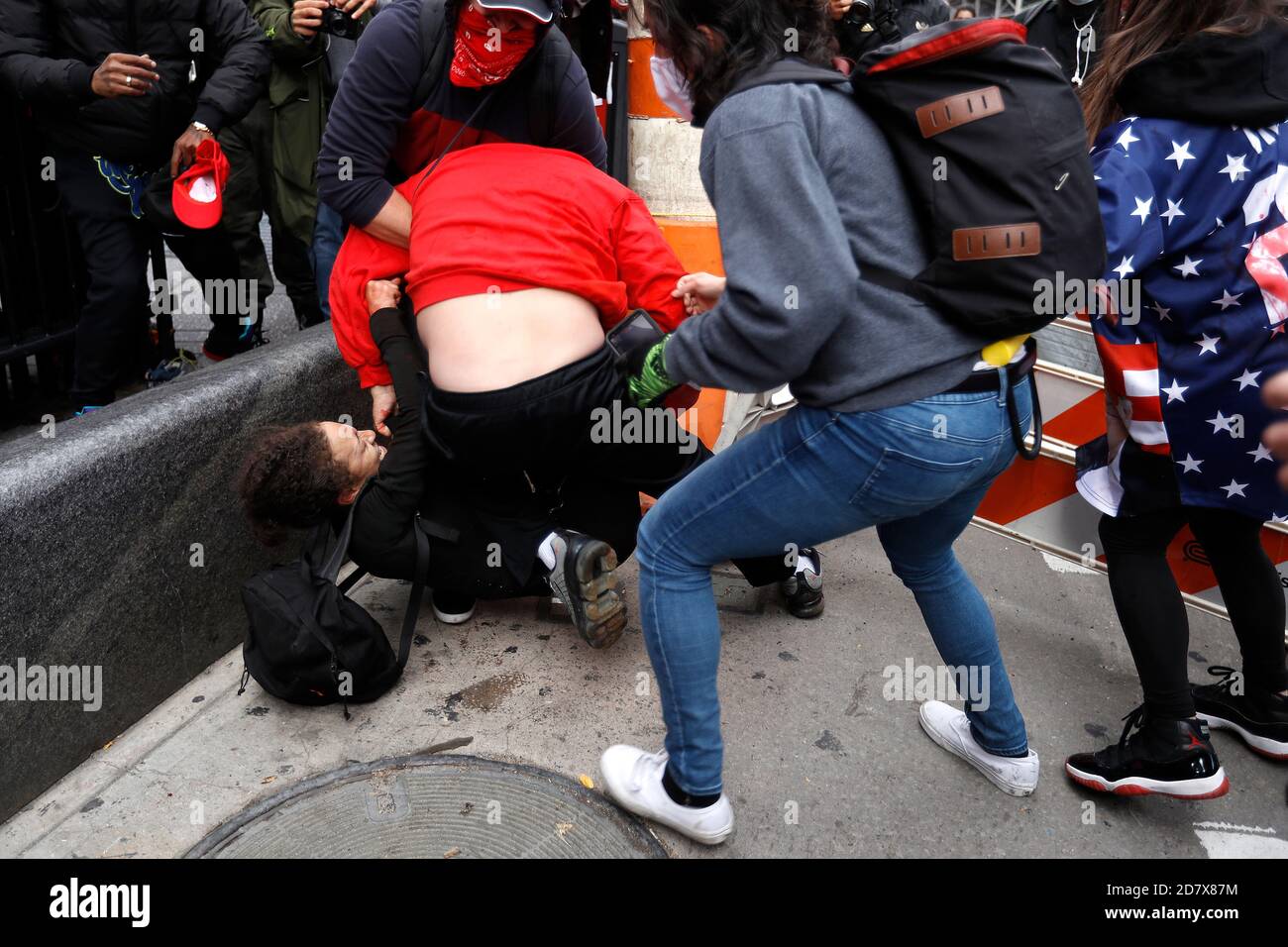 New York City, USA. 25th Oct, 2020. Pro Trump supporters clash with left-wing demonstrators following a march to Times Square on October 25, 2020 in New York City. As the November 3rd Presidential Election nears, tensions are high on both political lsides, often resulting in physical violence and police arrests. (Photo by John Lamparski/SIPA USA) Credit: Sipa USA/Alamy Live News Stock Photo