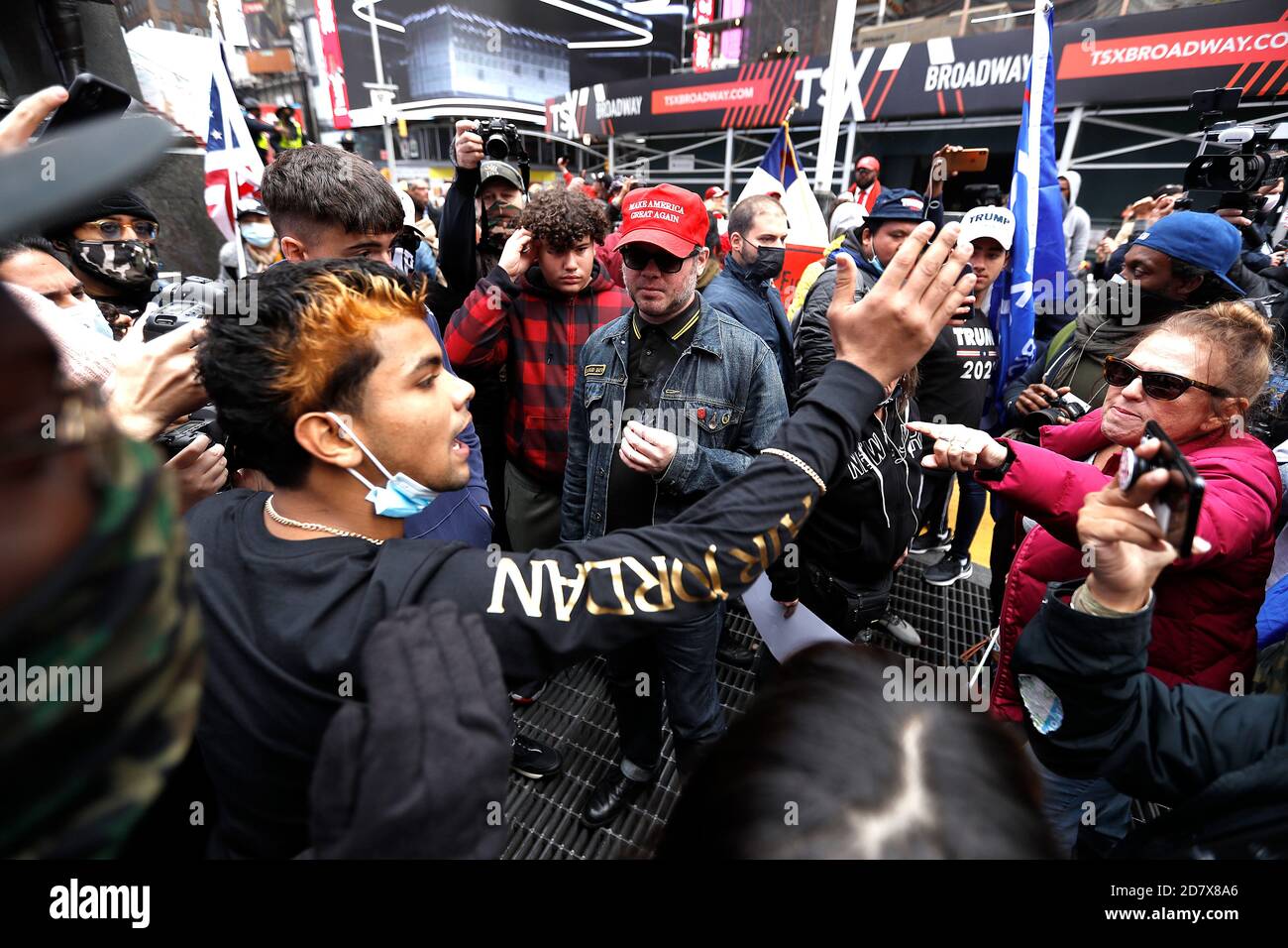 New York City, USA. 25th Oct, 2020. Pro Trump supporters clash with left-wing demonstrators following a march to Times Square on October 25, 2020 in New York City. As the November 3rd Presidential Election nears, tensions are high on both political lsides, often resulting in physical violence and police arrests. (Photo by John Lamparski/SIPA USA) Credit: Sipa USA/Alamy Live News Stock Photo