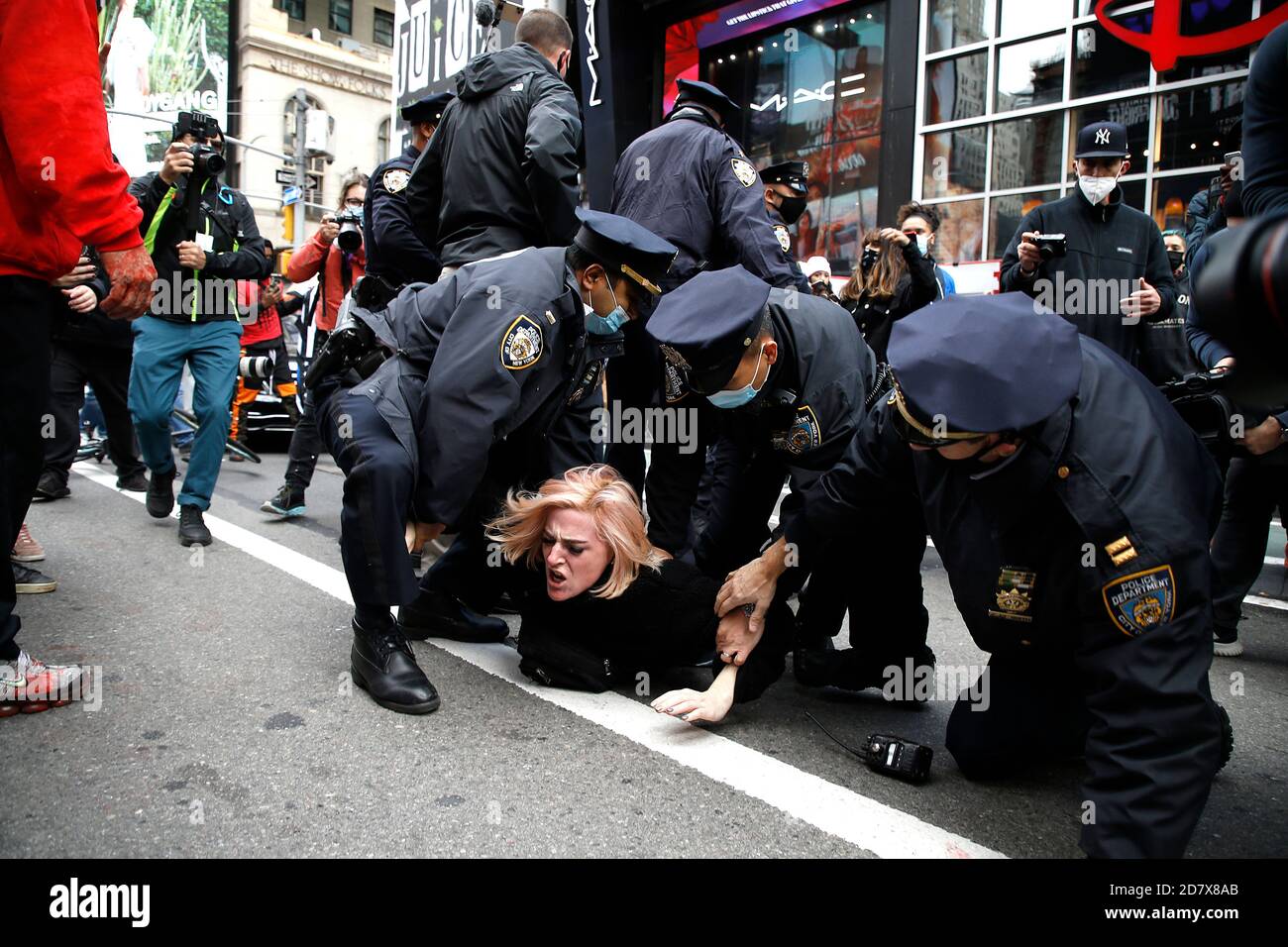 New York City, USA. 25th Oct, 2020. Pro Trump supporters clash with left-wing demonstrators following a march to Times Square on October 25, 2020 in New York City. As the November 3rd Presidential Election nears, tensions are high on both political lsides, often resulting in physical violence and police arrests. (Photo by John Lamparski/SIPA USA) Credit: Sipa USA/Alamy Live News Stock Photo