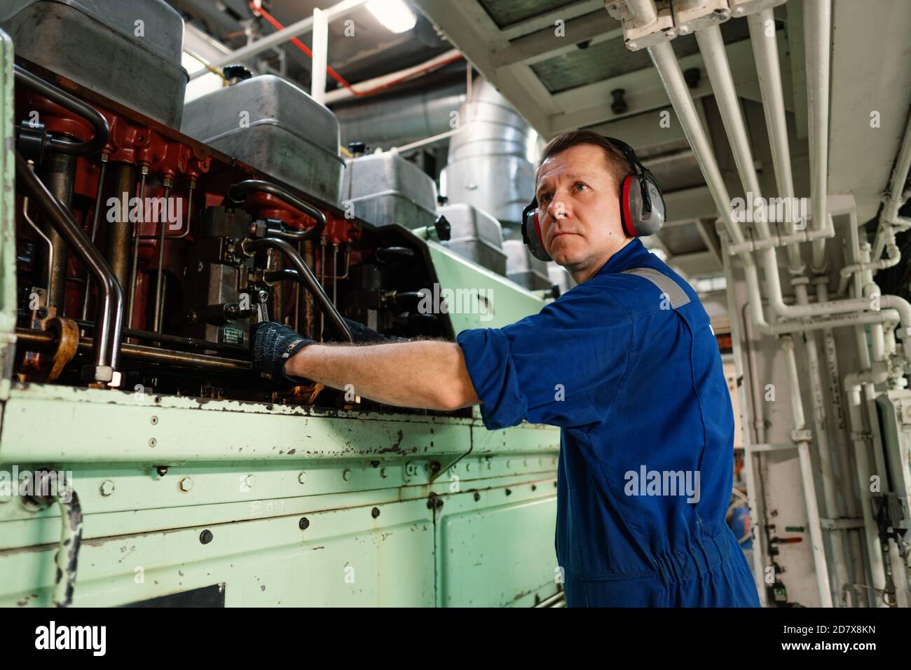 Marine engineer officer controlling vessel enginesand propulsion in ...