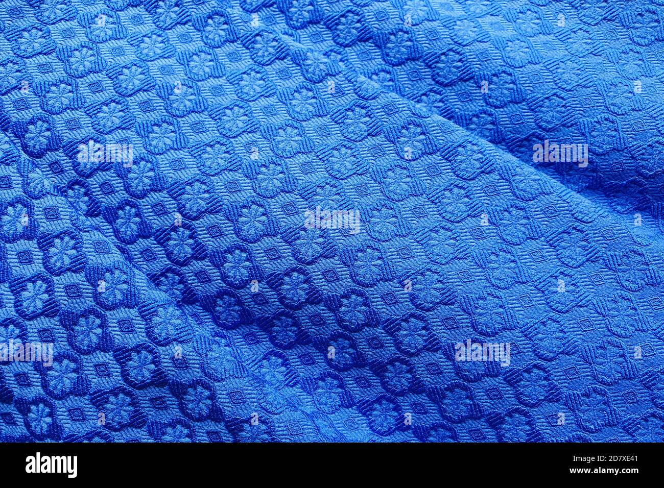 These are the folds of the noble blue fabric. The deep blue color of ...