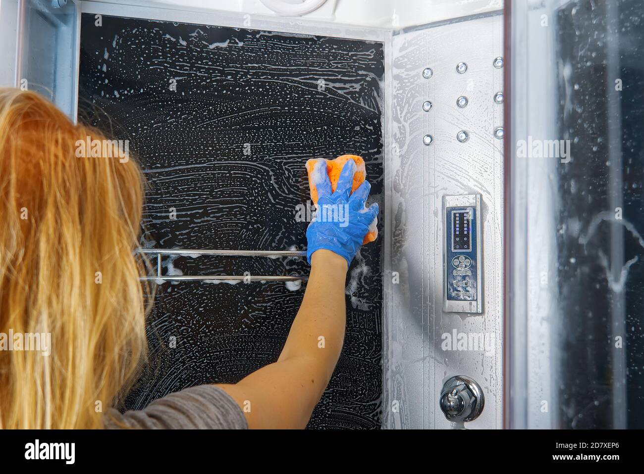 Cleaning of shower steam cabins from calcium deposits. Cleaning in the