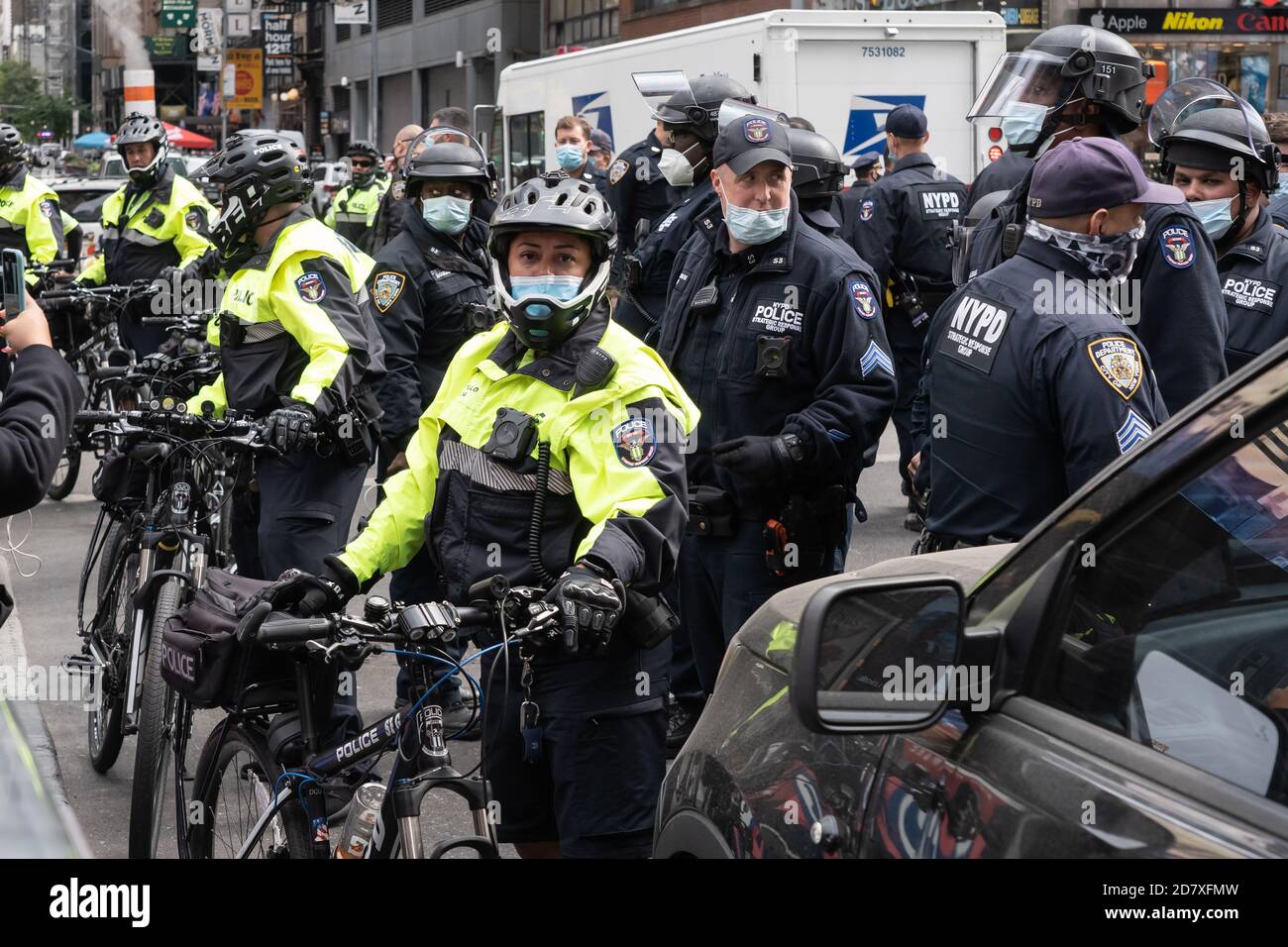 NEW YORK, NY – OCTOBER 25: NYPD Police Officers stand ready in Times ...