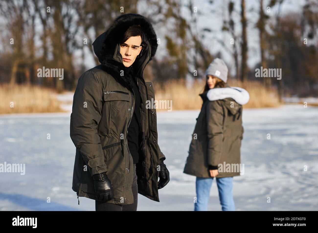 happy couple hugging and laughing outdoors in winter Stock Photo - Alamy