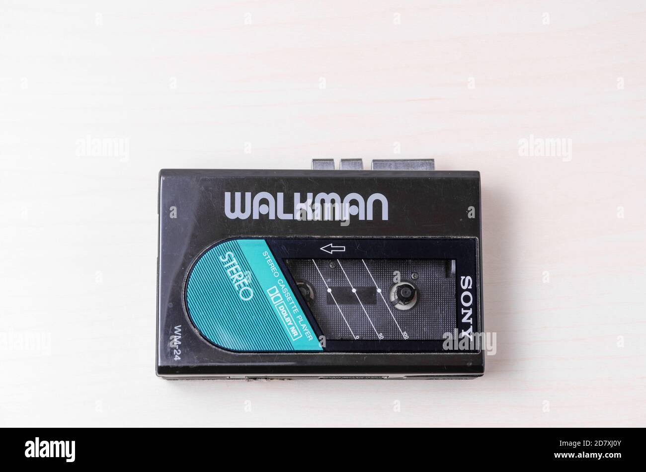 Sony Walkman Cassette Player WM-24, 1984 until 1987, compact audio music, on wooden desk or table, flat lay, studio Stock Photo