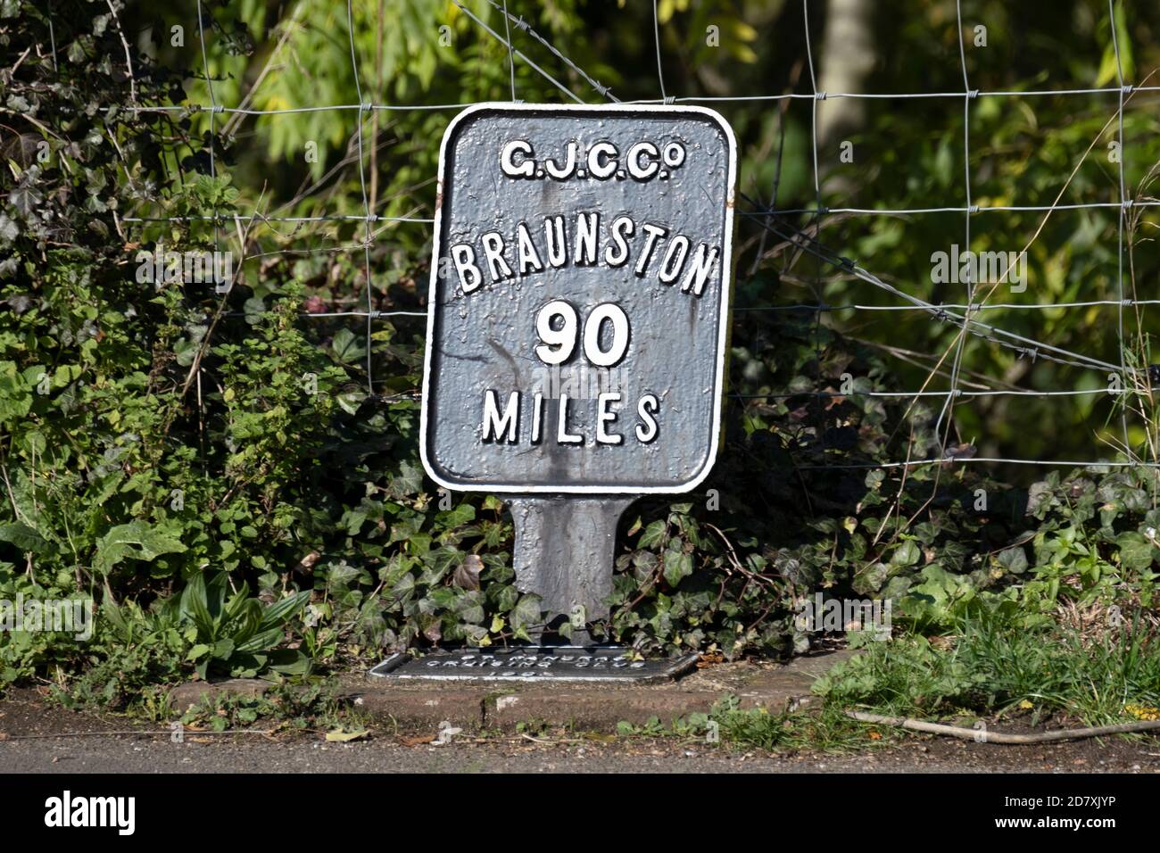 Mile Marker on the Grand Union Canal at Three Bridges in Hanwell West London showing the distance to Braunston, the centre of the canal network. Stock Photo