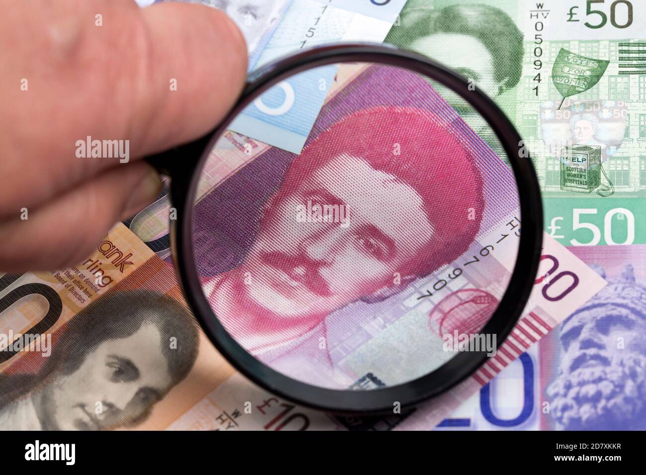 Scottish pound in a magnifying glass Stock Photo
