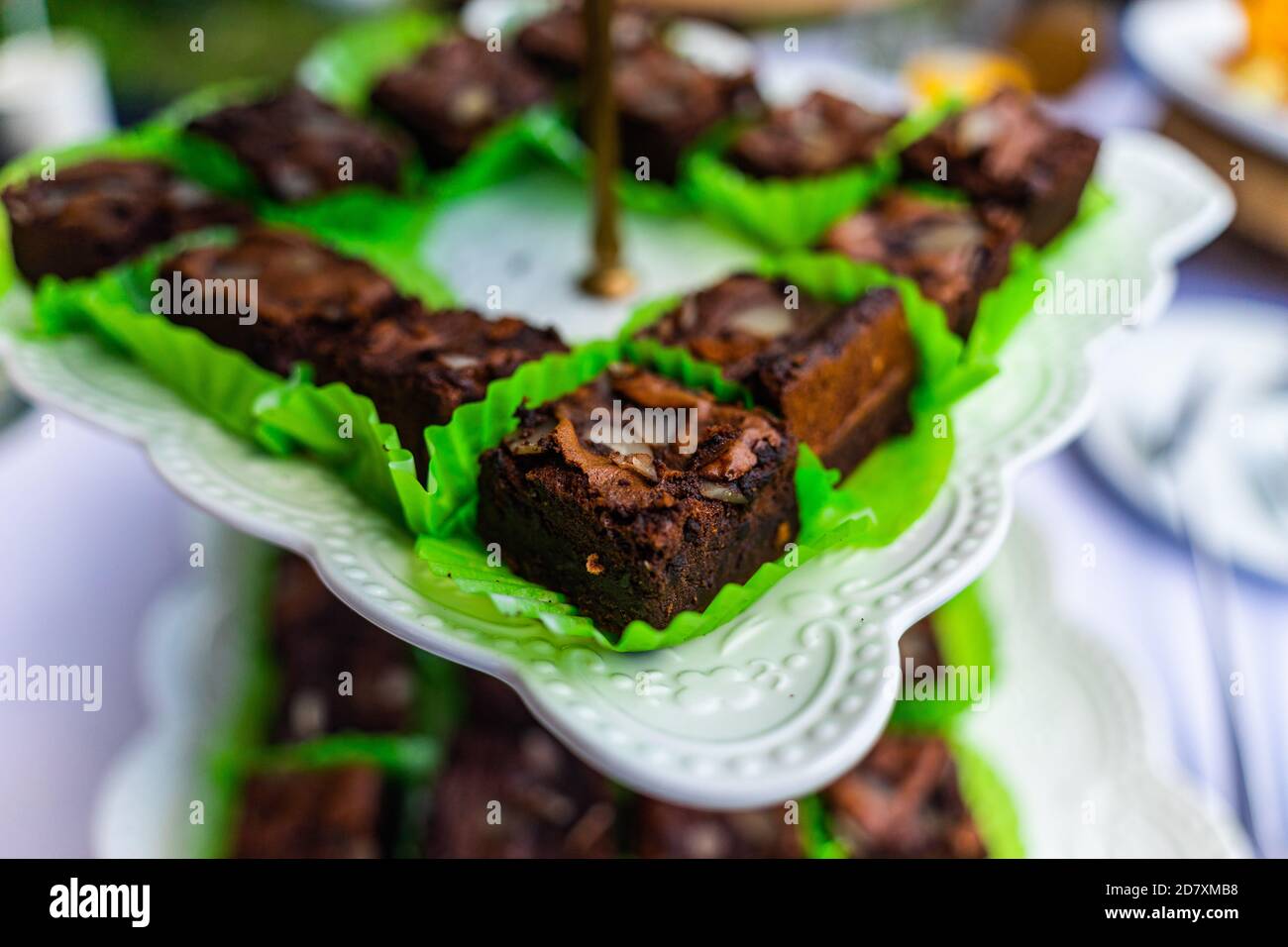 small cakes with different stuffing on party or wedding table. Selective focus. Stock Photo