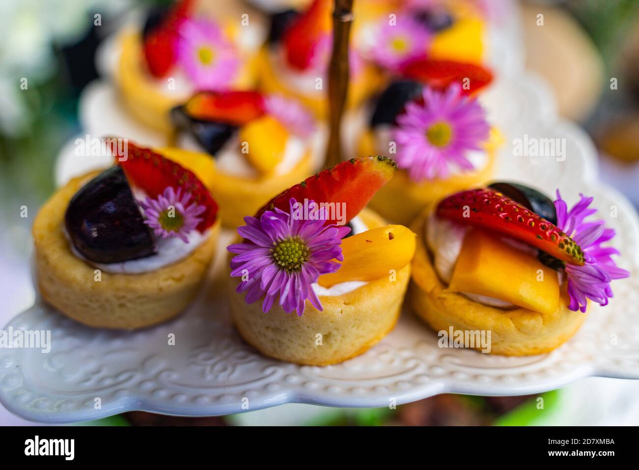 small cakes with different stuffing on party or wedding table. Selective focus. Stock Photo