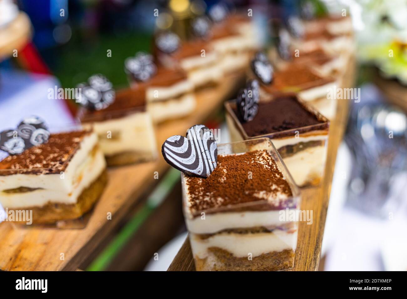 small cakes with different stuffing on party or wedding table. Selective focus. Stock Photo