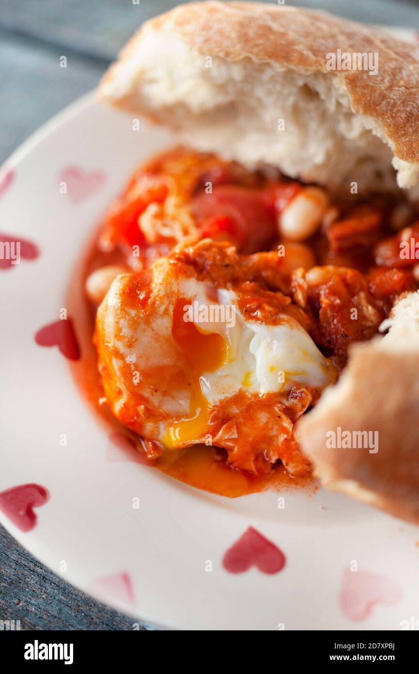 Spicy chorizo,bean,tomato and egg stew Stock Photo Alamy