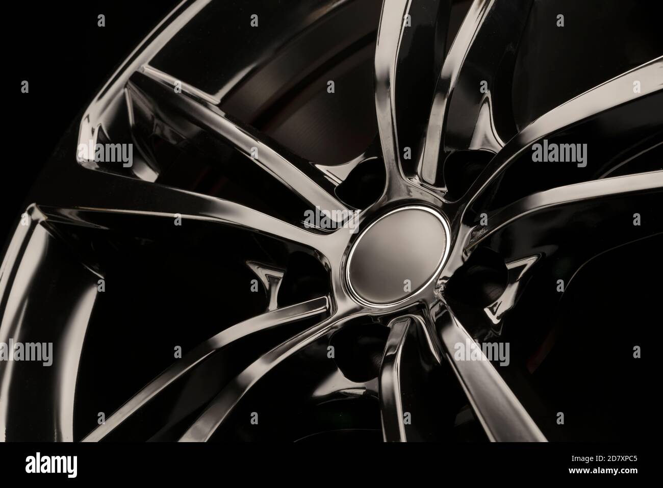 Black Gloss alloy wheel on a dark background. Stylish and expensive