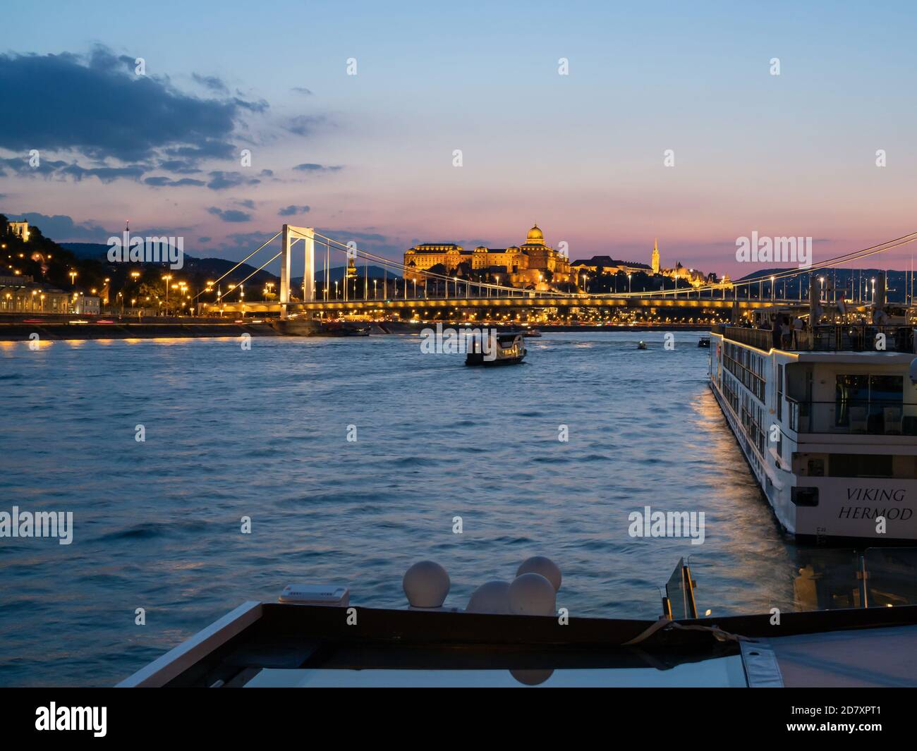 BUDAPEST, HUNGARY -  JULY 16, 2019:  Night view along the Danube river with Szechenyi Chain Bridge with Budapest Castle Stock Photo