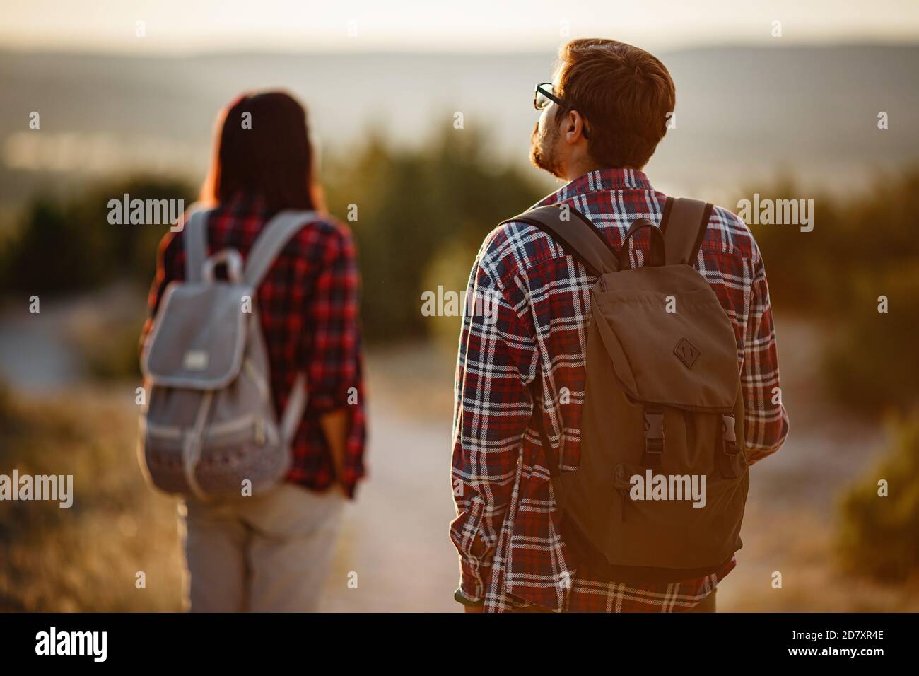 Portrait of happy young couple having fun on their hiking trip ...