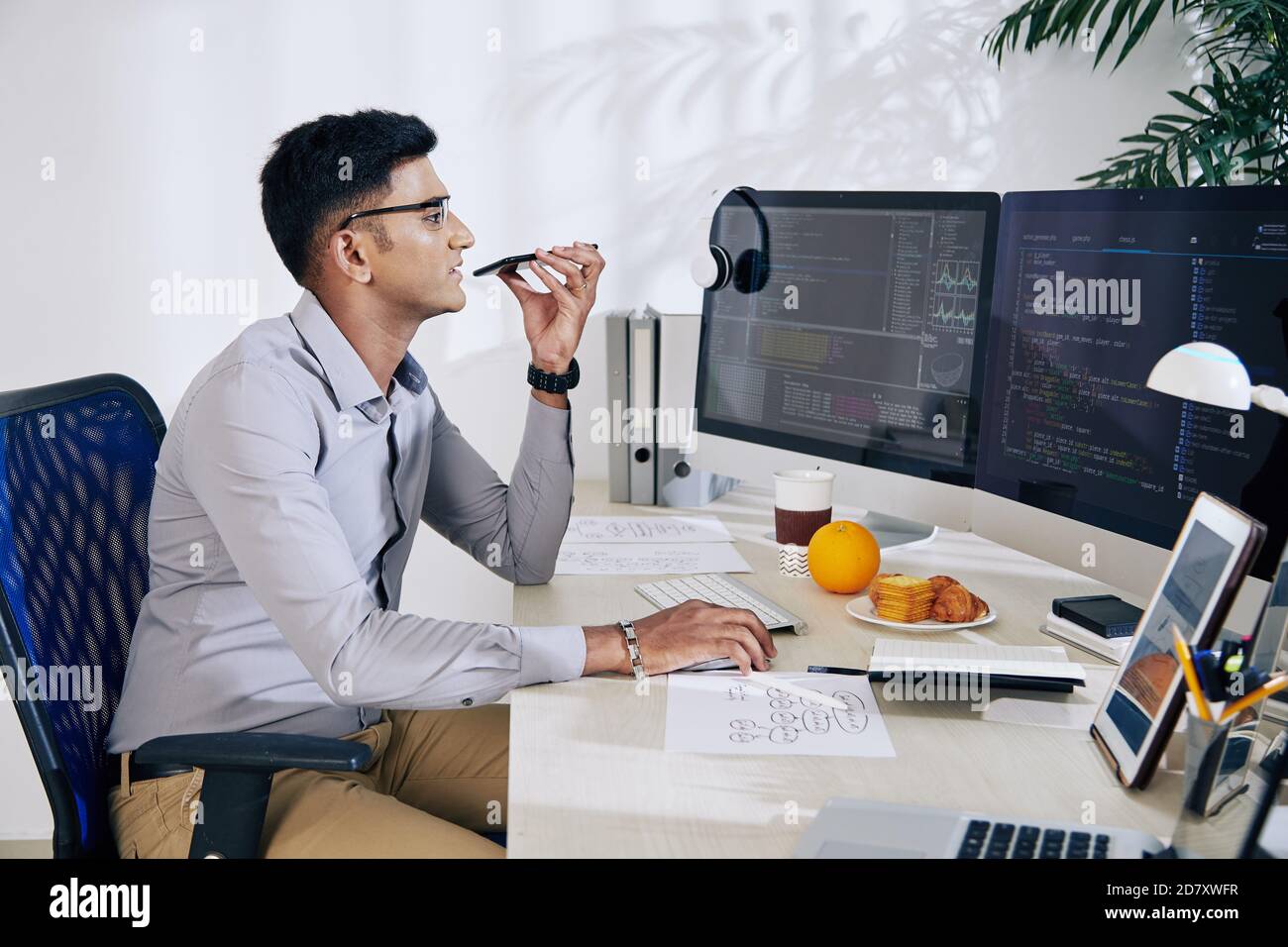 Programmer recording voice message Stock Photo