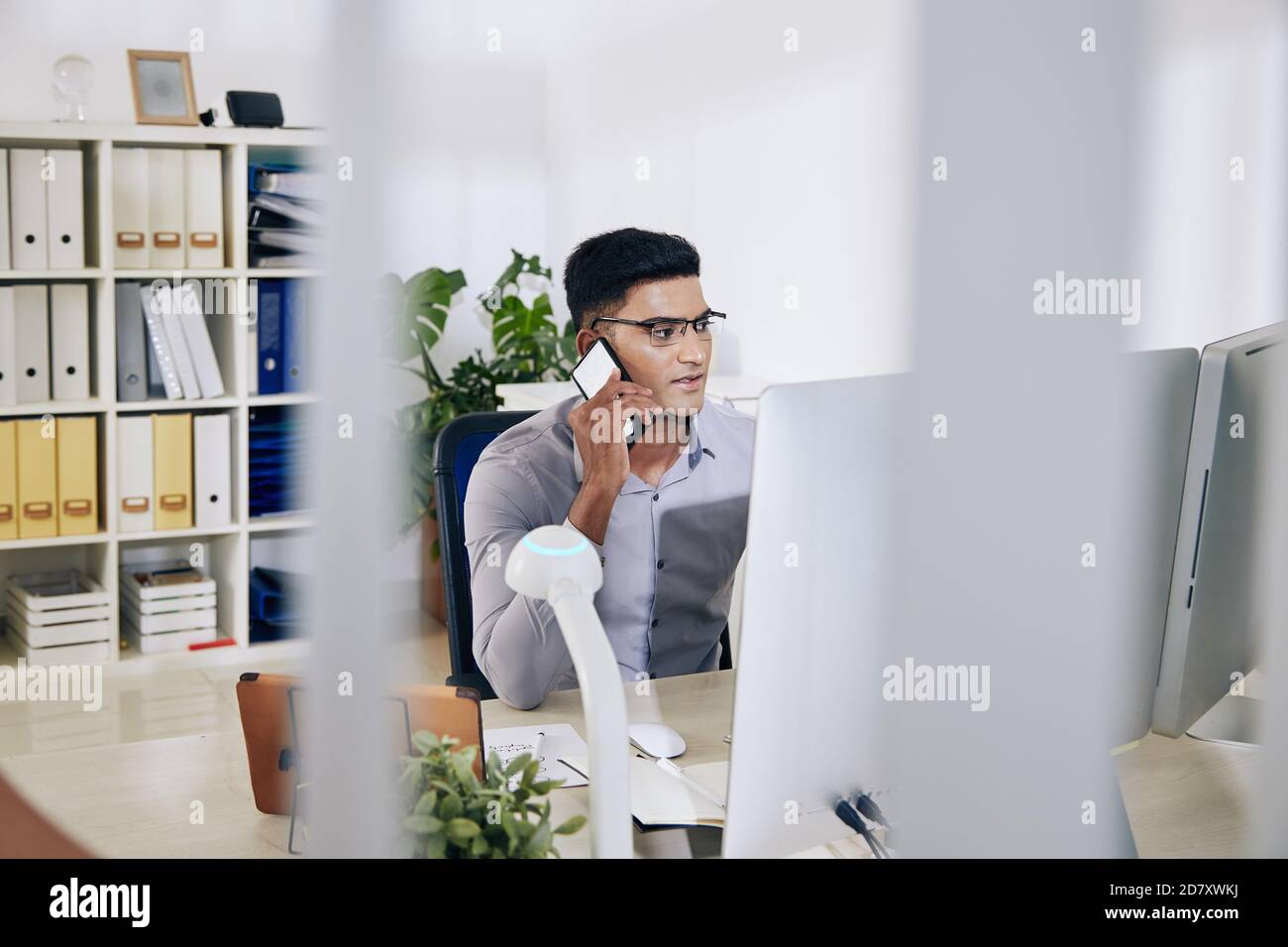 Indian entrepreneur talking on phone Stock Photo