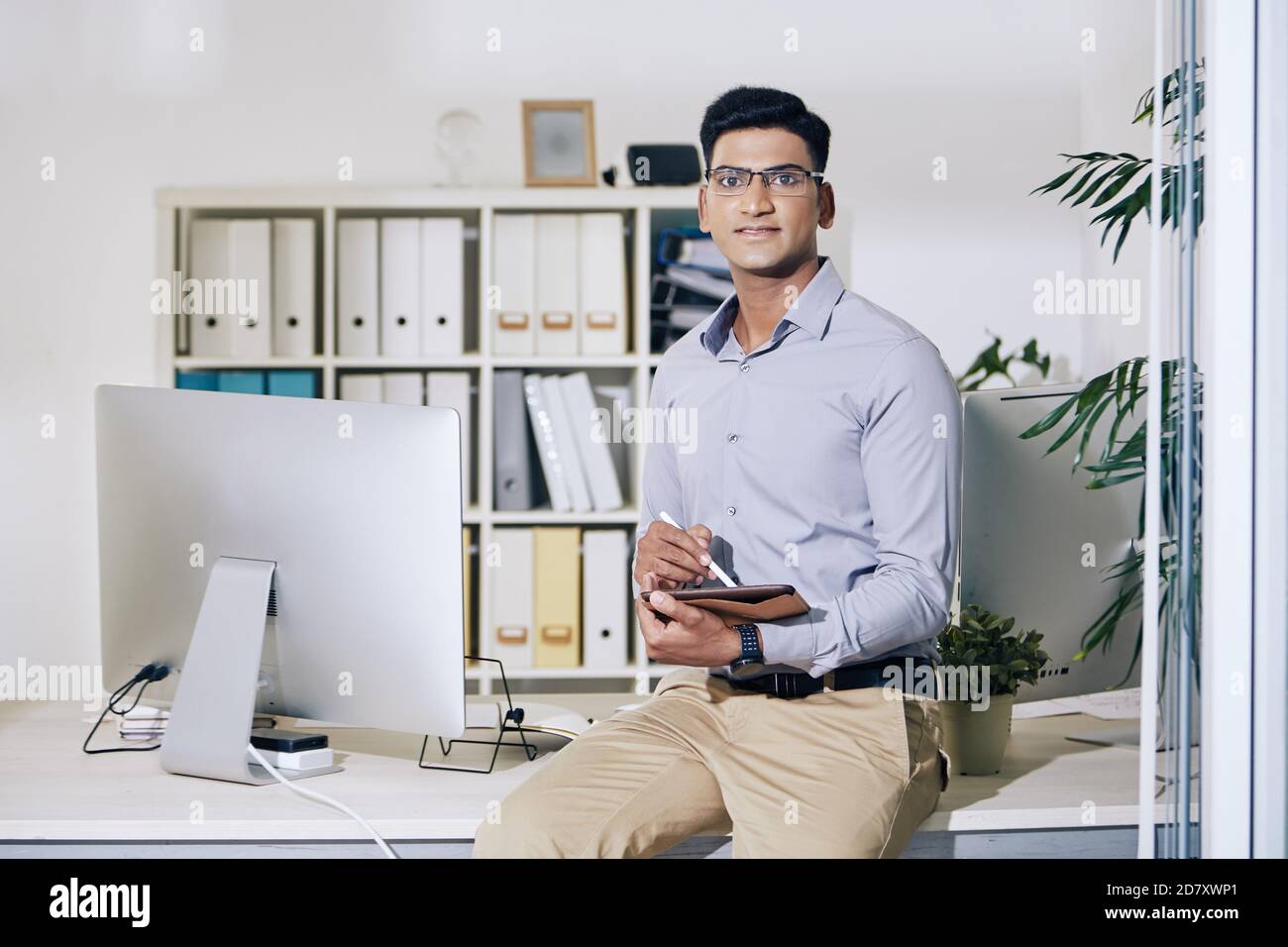 Young Indian entrepreneur with tablet Stock Photo
