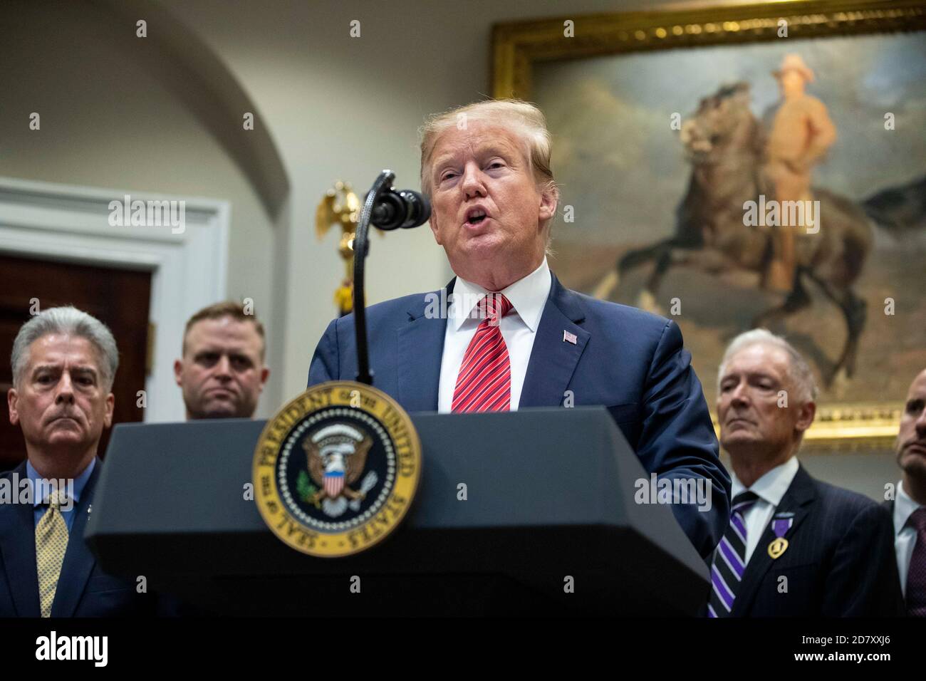 President Donald Trump delivers remarks prior to signing an Executive Order entitled  'National Roadmap to Empower Veterans and End Suicide' in the Roosevelt Room of the White House in Washington, D.C. on March 5, 2019. While answering questions after the signing, Trump told reporters, 'The witch hunt continues,' referring to Congressional Democrats efforts to investigate the Presidents' son in law, and Presidential Advisor Jared Kuschner. Credit: Alex Edelman/The Photo Access Stock Photo