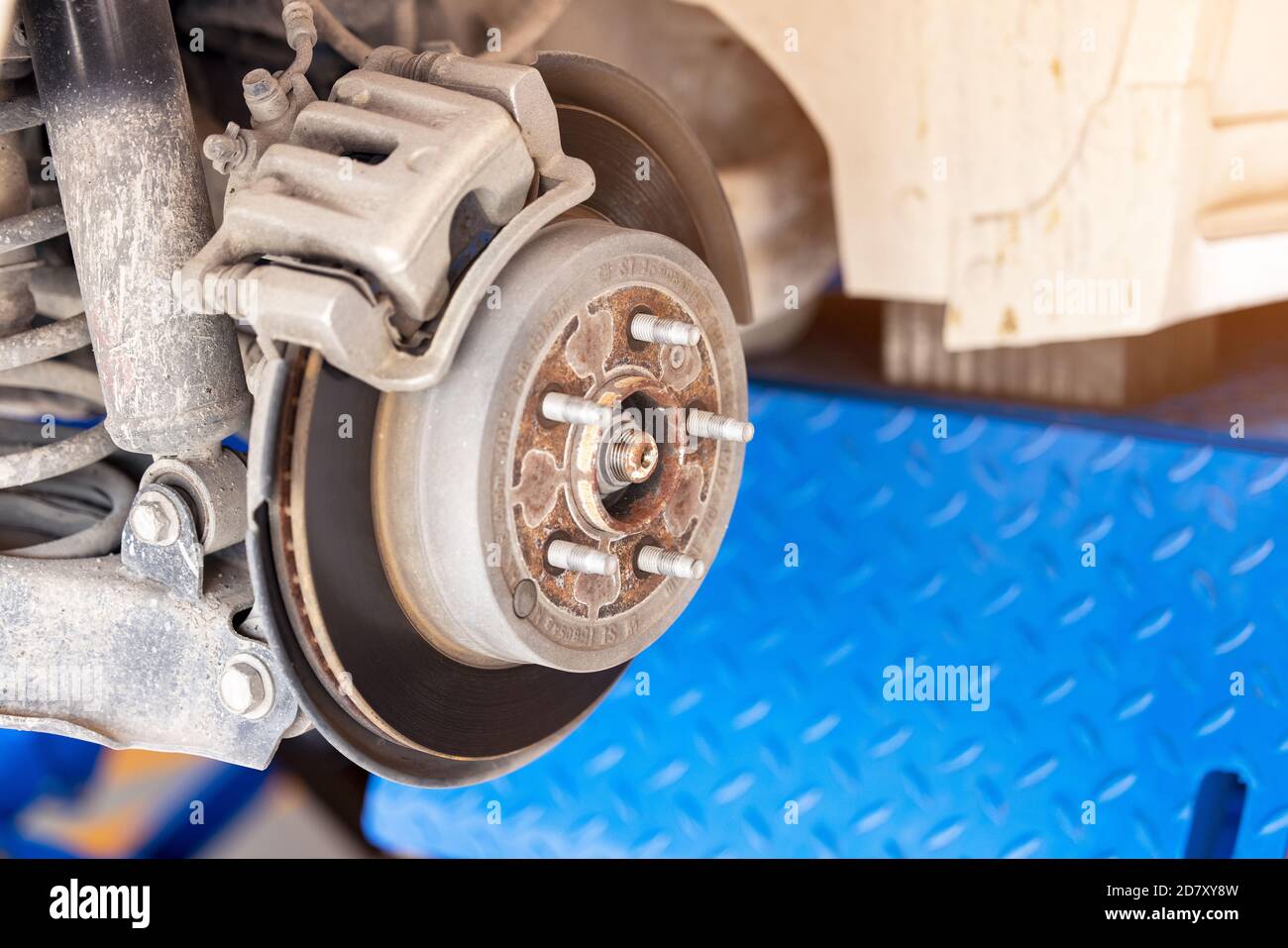Close up Car brake part at garage, Old and dirty rear dump break of the