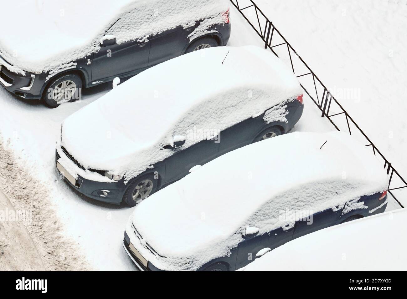Snow covered cars are parked in winter Stock Photo - Alamy